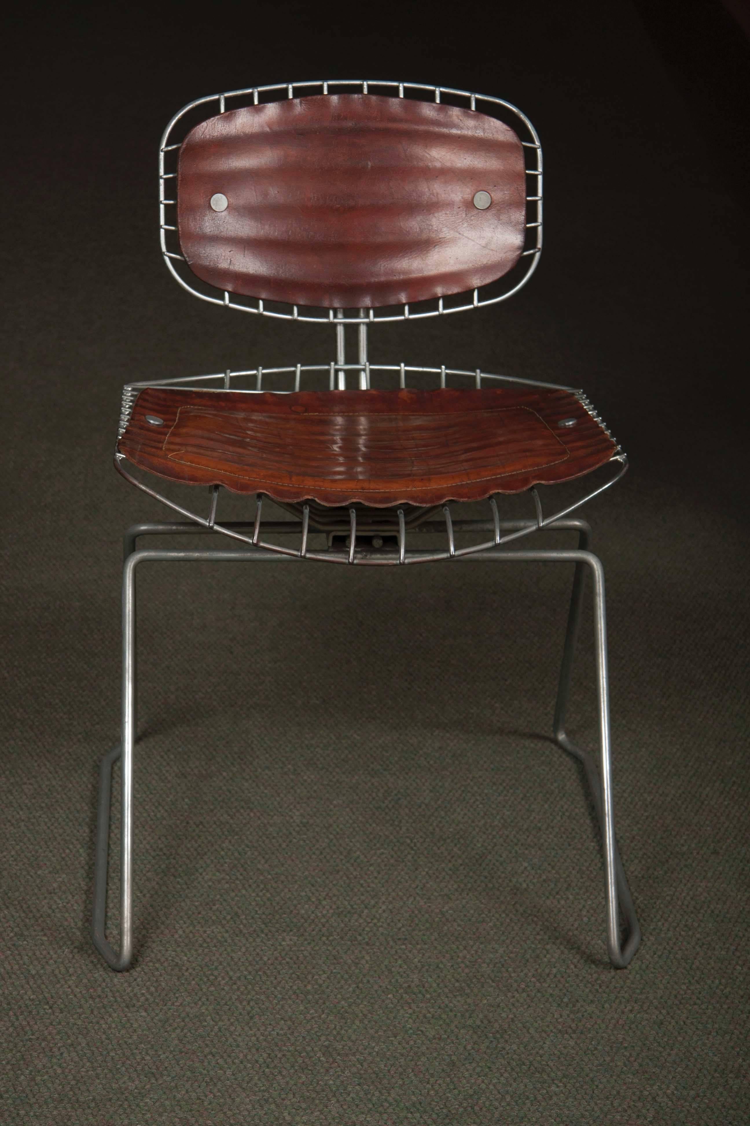 A matched set of eight Michel Cadestin and Georges Laurent leather and metal Beaubourg chairs, from the Centre Georges Pompidou, Paris. These chairs were designed in 1976 for the competition to determine which chairs would be used in the Pompidou