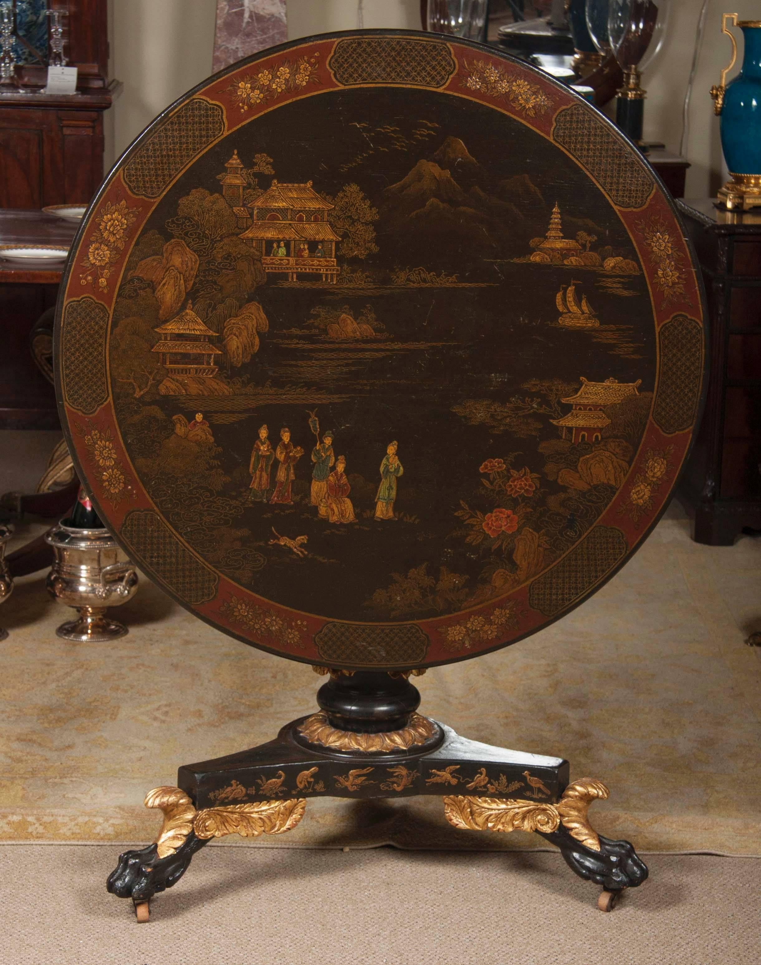 A late 19th century Japanned and parcel-gilt Regency style tilt-top table.