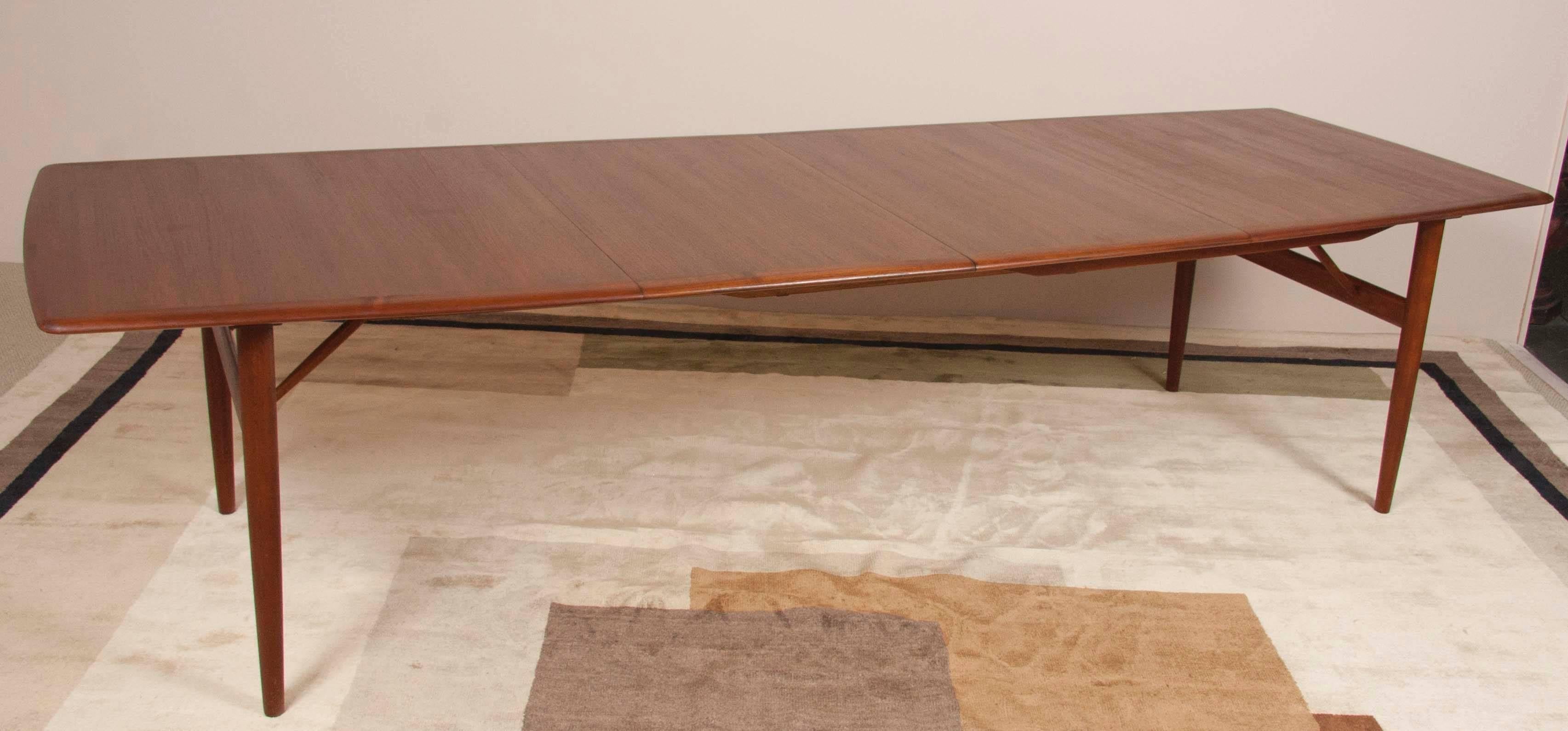A Povl Dinesen model PD 700 Teak dining table with great support stretchers. This table has two 23 1/2 inch leaves. The total length of the table with leaves is 118 inches.
 
