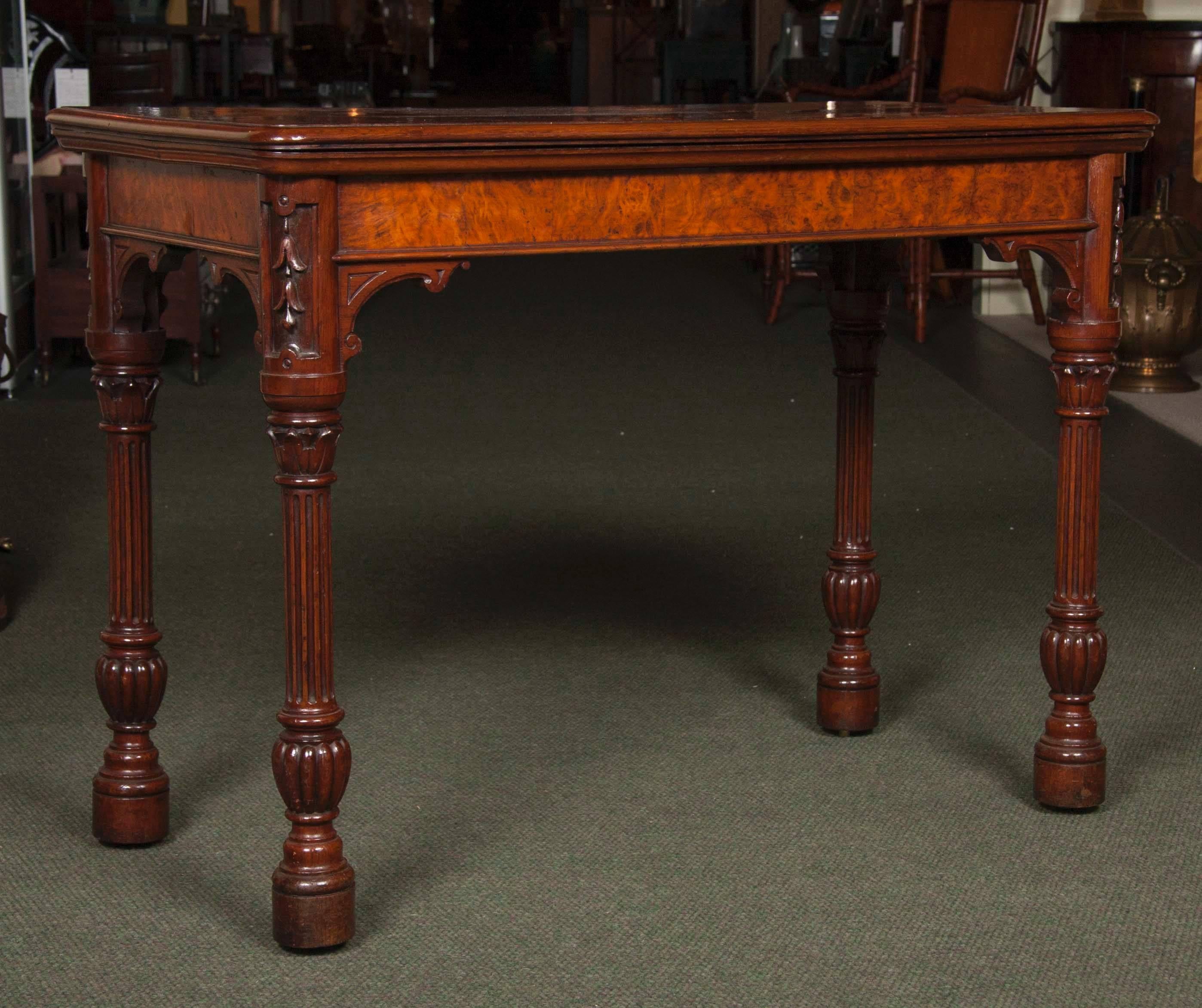 Rare antique pollard oak card table. It boasts a lovely mellow color and is well proportioned with a subtle Gothic influence making it look like a side/serving table when closed. It features a fine quality pollard oak top with thumb moulded edge