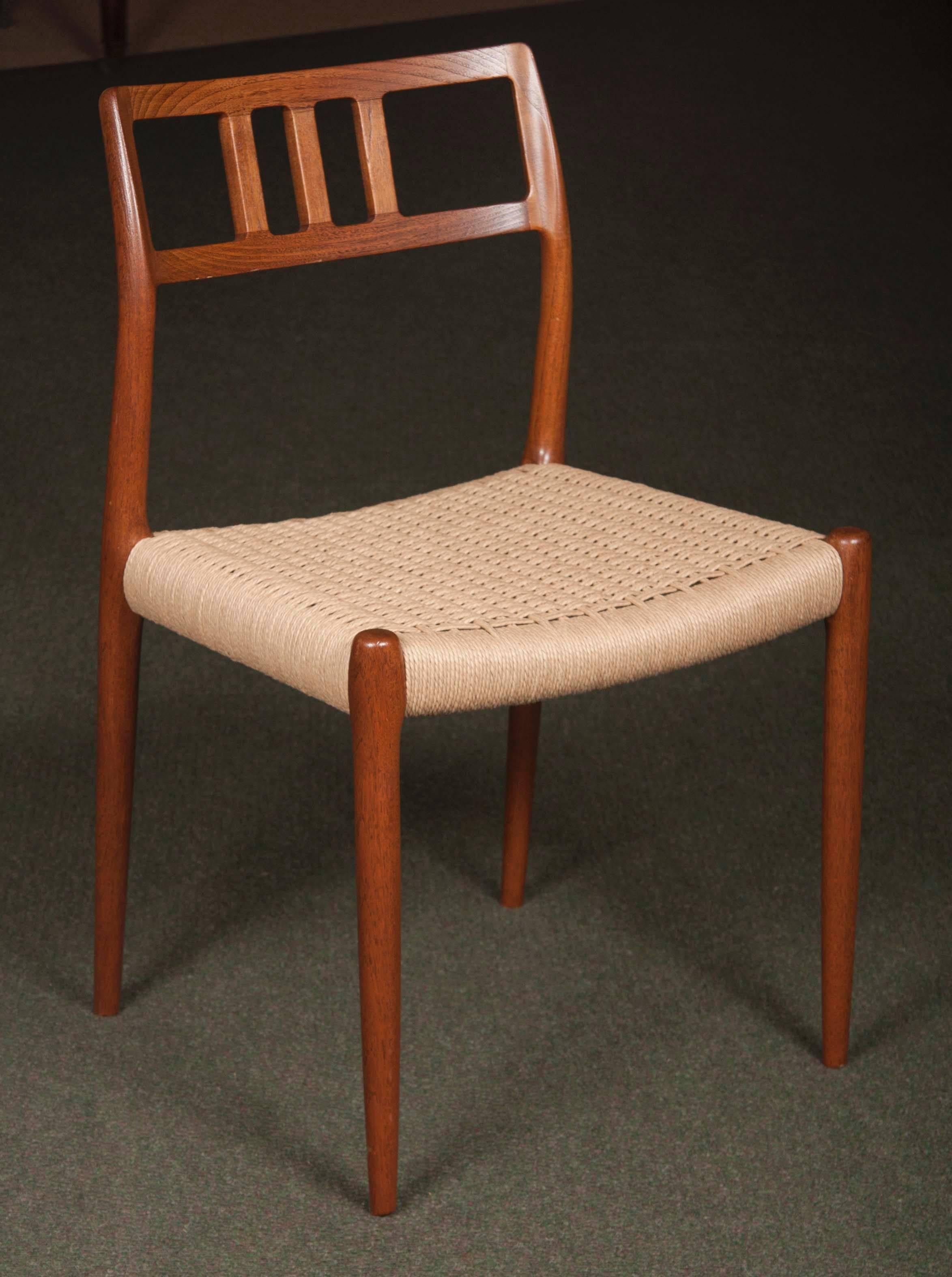 A set of 11 Niels Otto Moller teak dining chairs. All side chairs. All chairs are reupholstered.