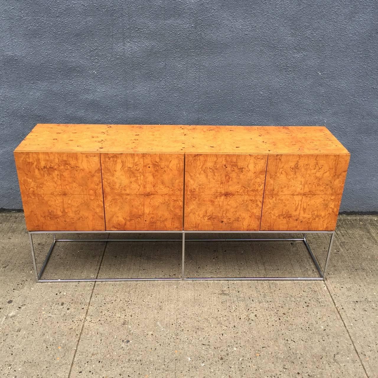 For your consideration is a beautiful Milo Baughman for Thayer Coggin sideboard/credenza in bookmatched olive burl wood veener on a slim chrome base. 

The piece is a beautiful mid-1970s statement piece from one of the masters of American design.