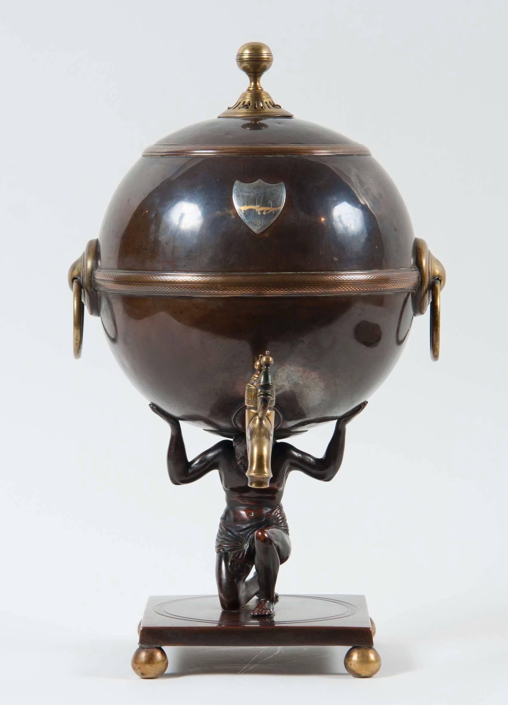 A late 19th century patinated metal and brass samovar depicting Atlas. Probably English.