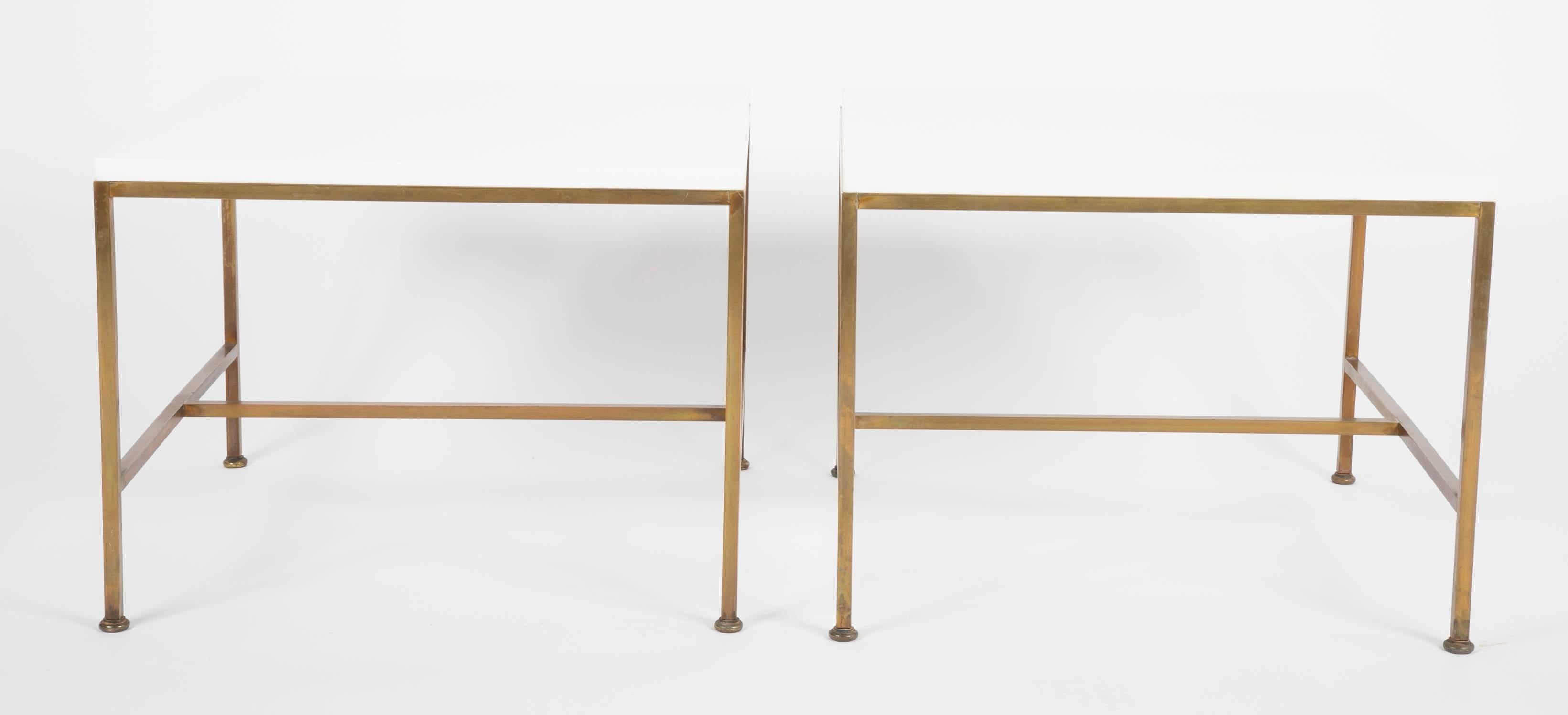 A pair of Paul Maccobb side tables for Calvin with brass bases and vitrolite tops.