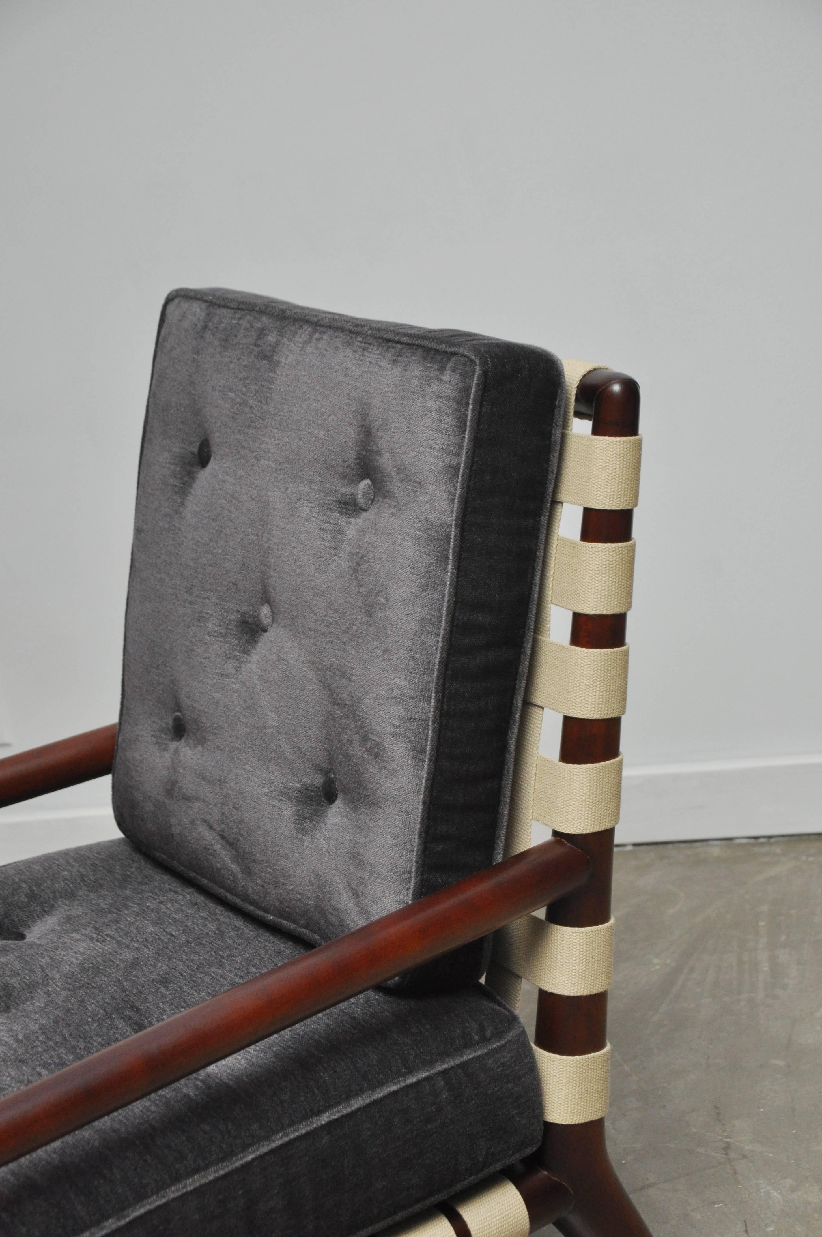 Strap frame lounge chairs by T.H. Robsjohn-Gibbings. Coveted strap frames with new charcoal mohair cushions. Chairs have been fully restored. Classic and beautiful Gibbings design.