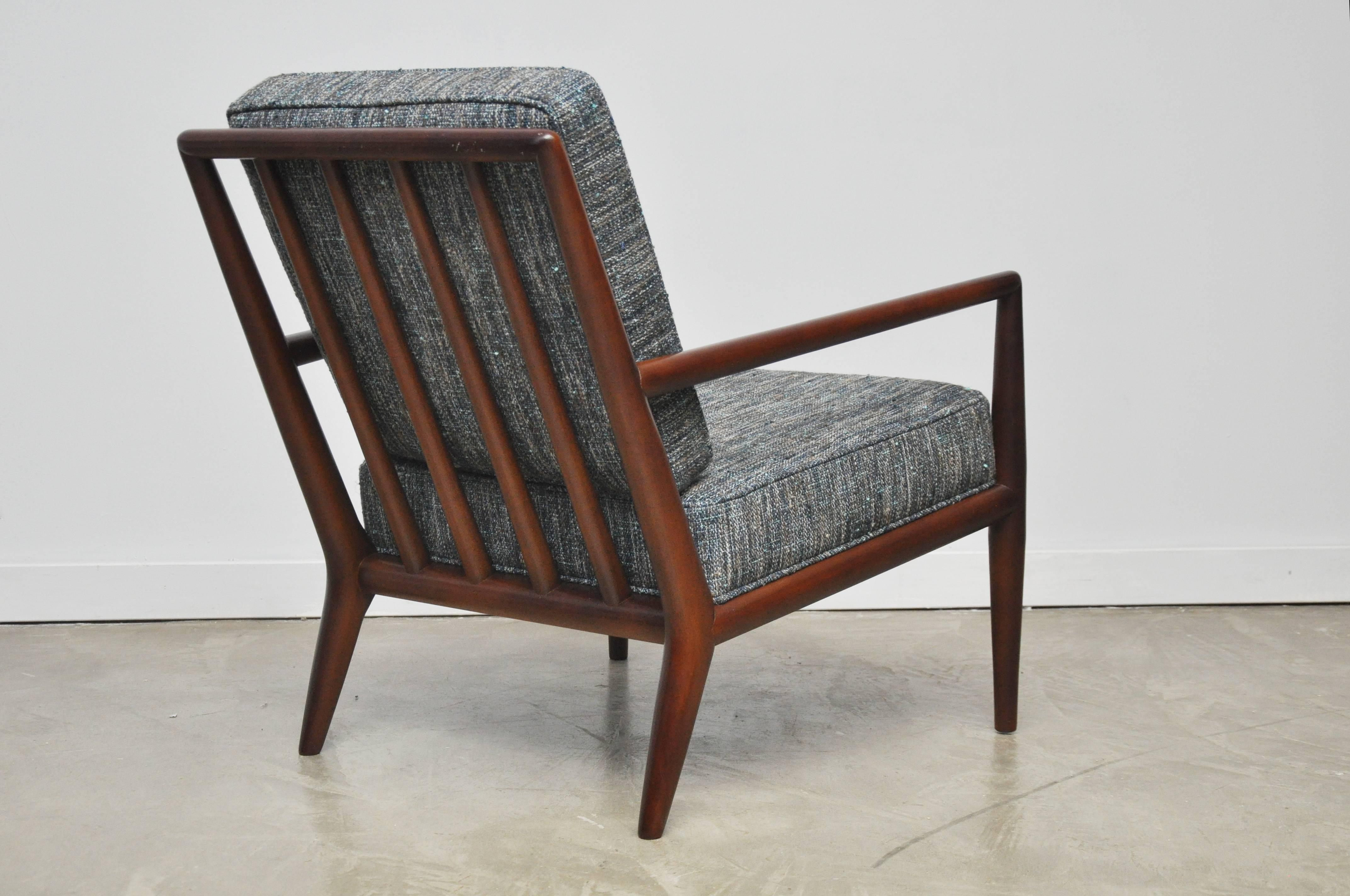 Pair of lounge chairs by T.H. Robs John-Gibbings. Fully restored walnut frames with new blue woven upholstery cushions.