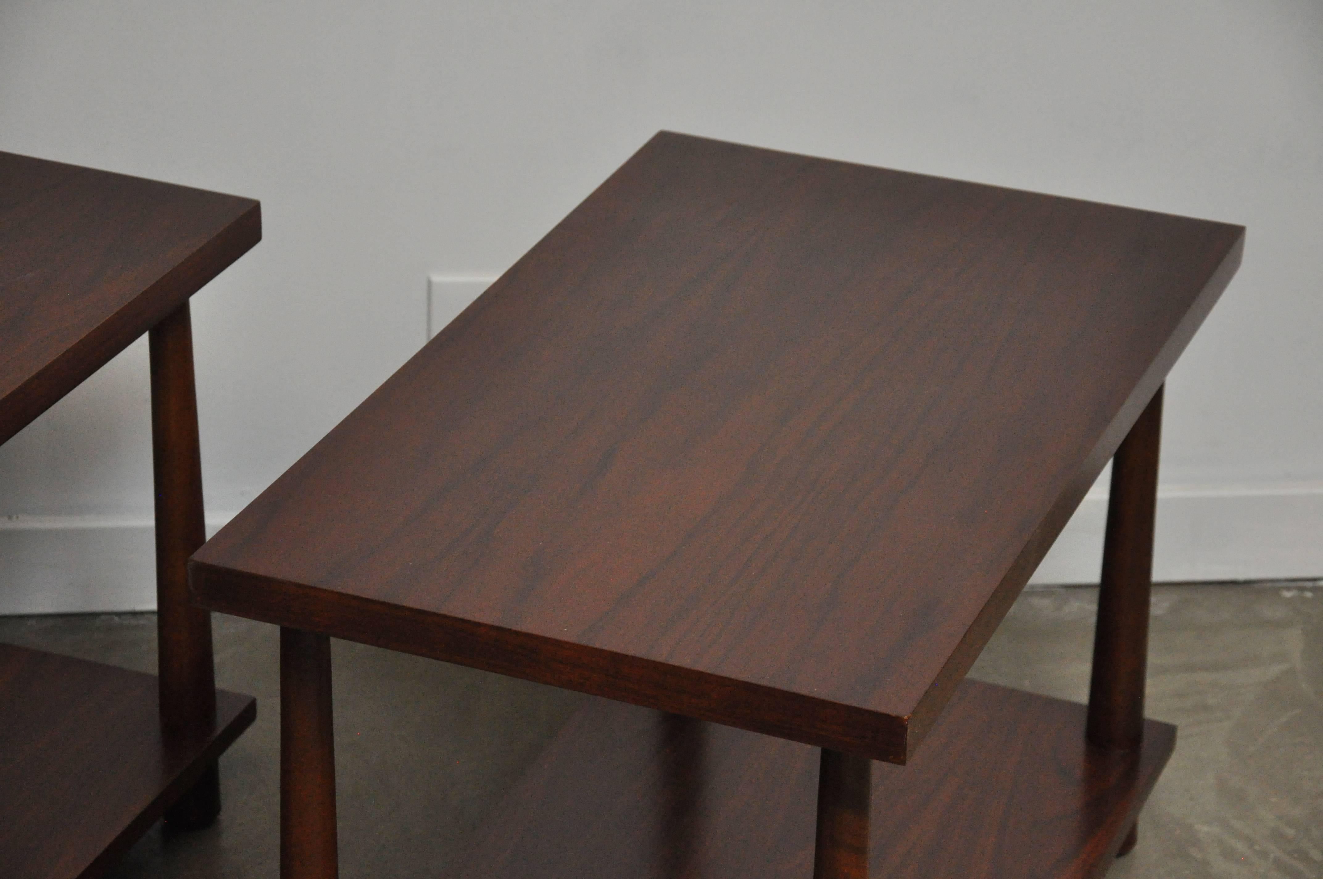 Pair of refinished walnut finish end tables by T.H. Robsjohn-Gibbings. Beautiful natural wood grain.