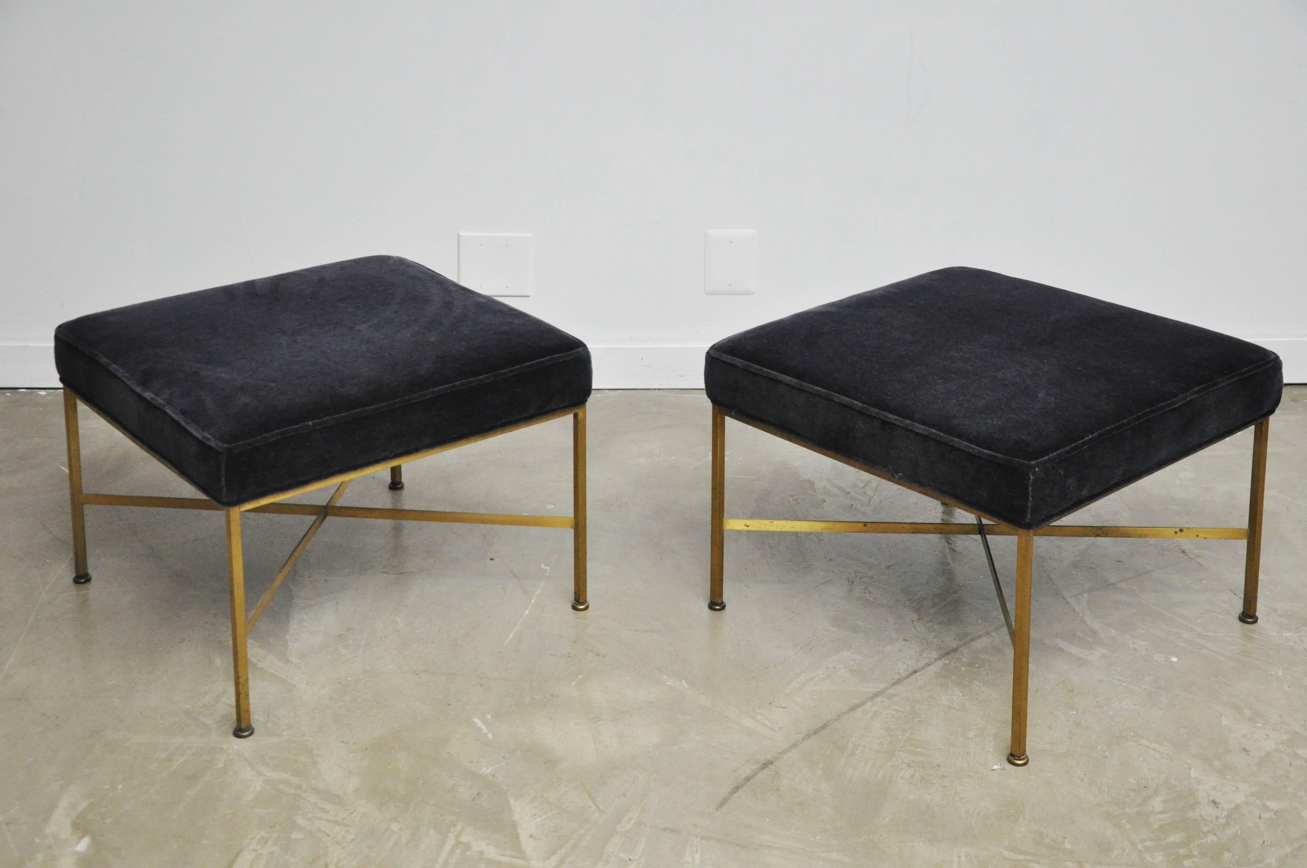 Pair of brass X-base stools Paul McCobb for Calvin furniture. New black mohair cushions over brass bases with nice original patina.