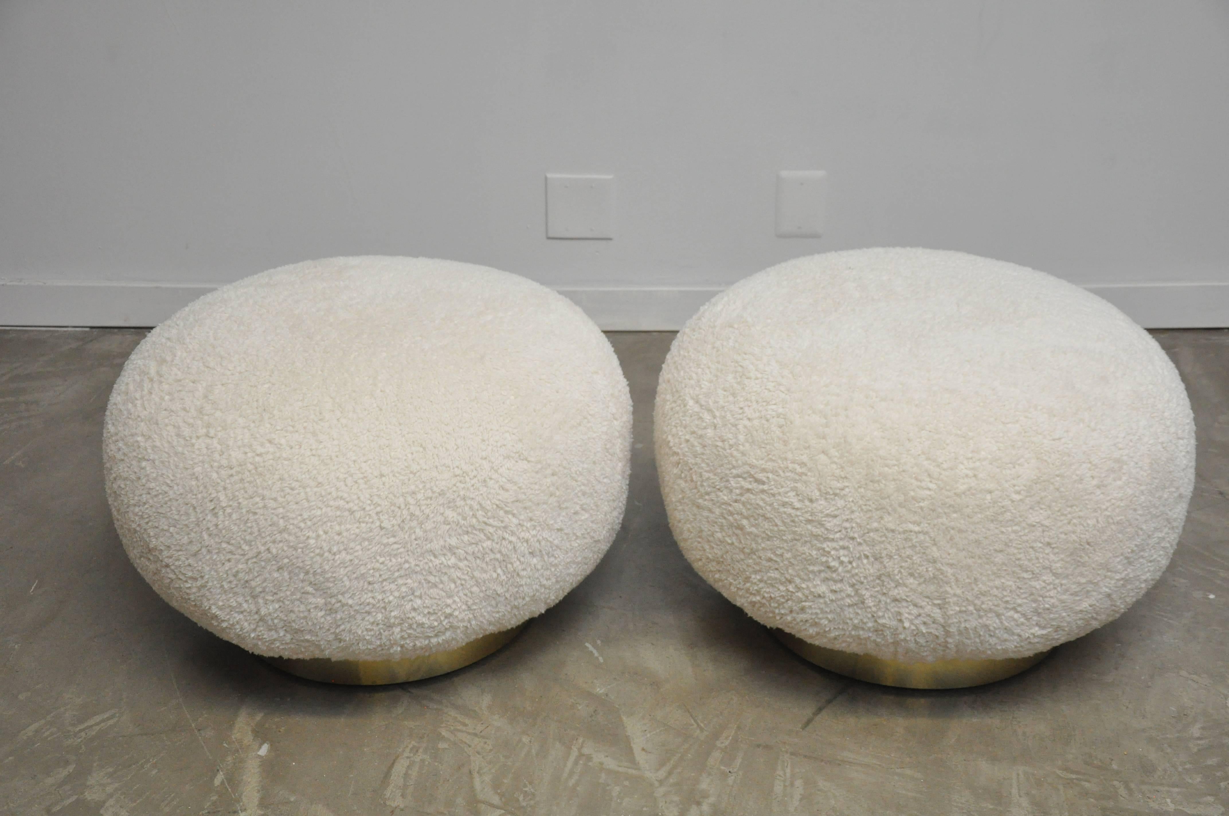 Pair of swivel stools by Adrian Pearsall for Comfort Design. Plush white upholstery over brass bases.