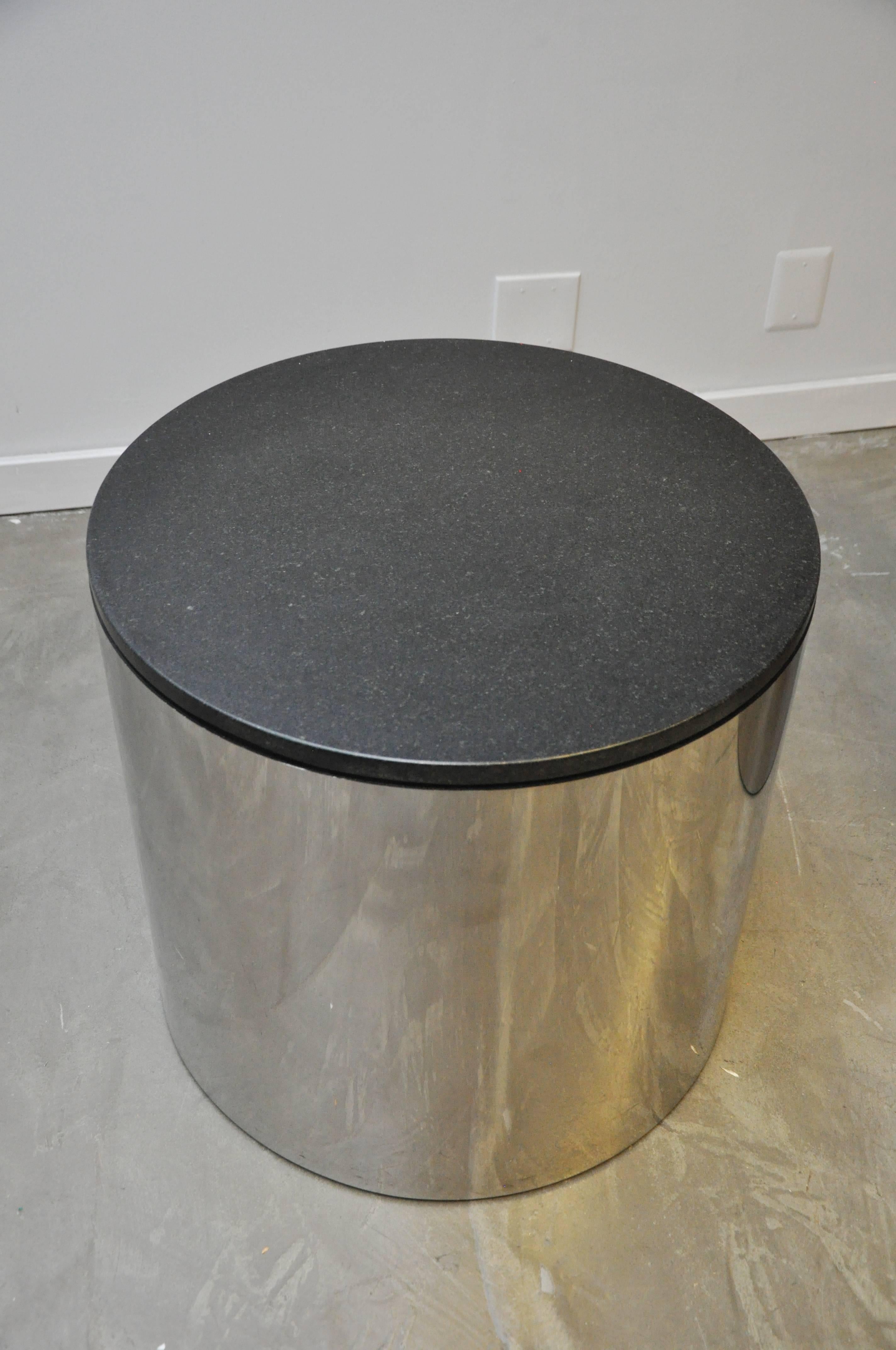 Pair of stainless and black granite side tables by Paul Mayan for Habitat.