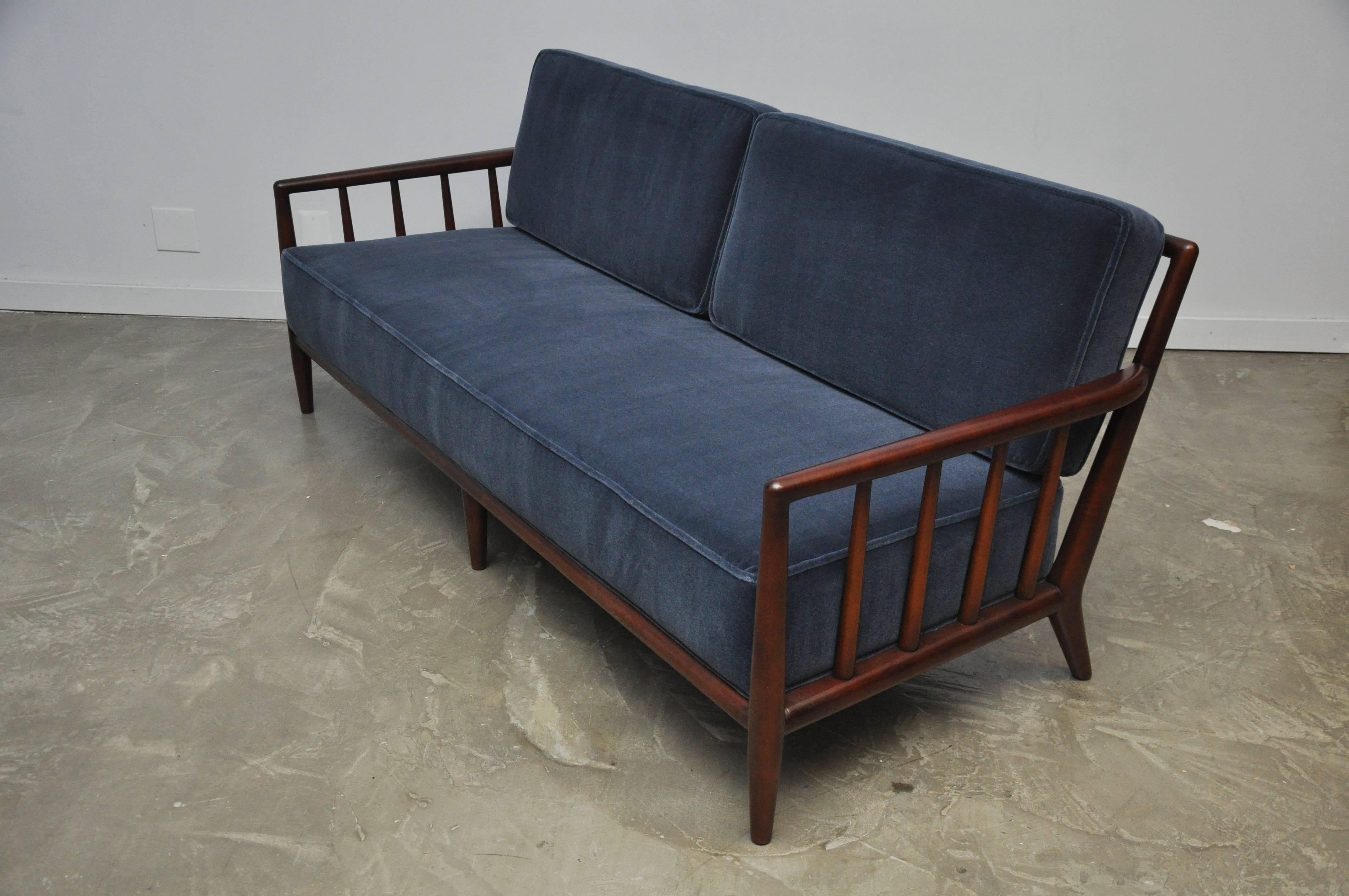 Walnut frame sofa by T.H. Robsjohn-Gibbings. Fully restored, refinished and reupholstered in dark blue mohair.