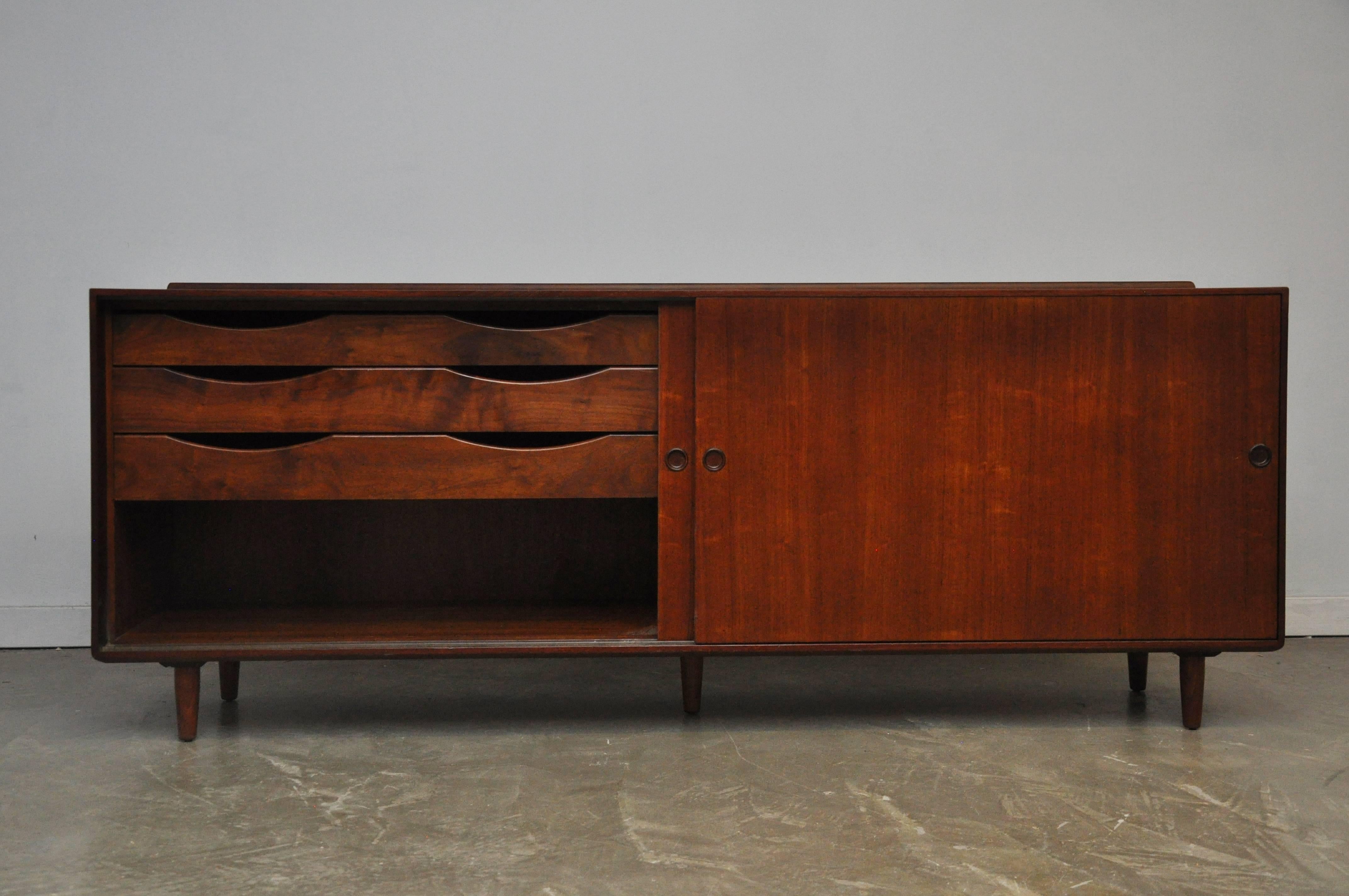Walnut sideboard by Finn Juhl for Baker. Beautifully restored cabinet with plenty of storage.