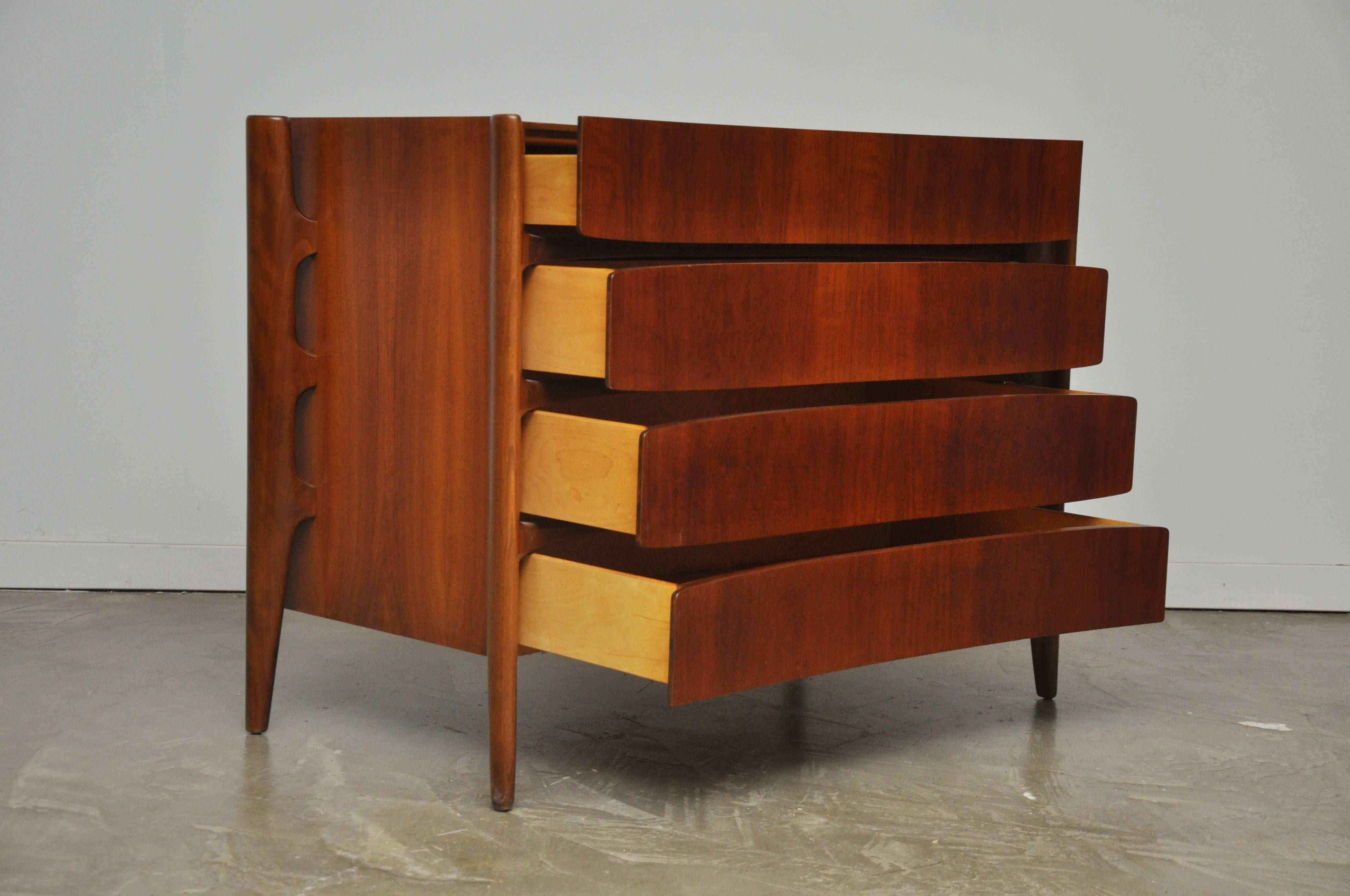 Beautiful walnut chest by William Hinn with exposed exoskeleton frame. Fully restored and refinished.
 