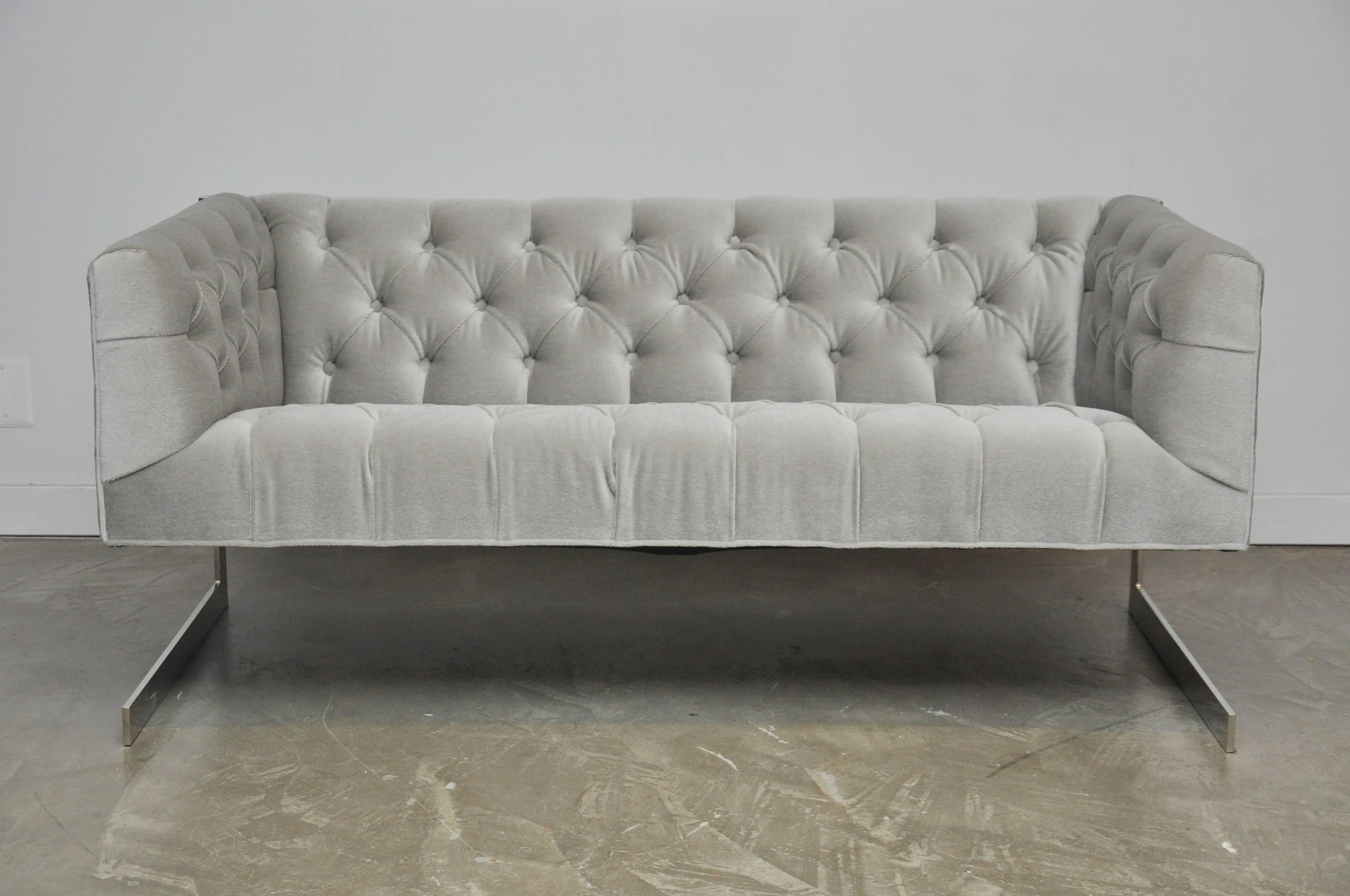 Chrome frame cantilever sofa by Milo Baughman. Fully restored. Newly upholstered in tufted grey mohair.