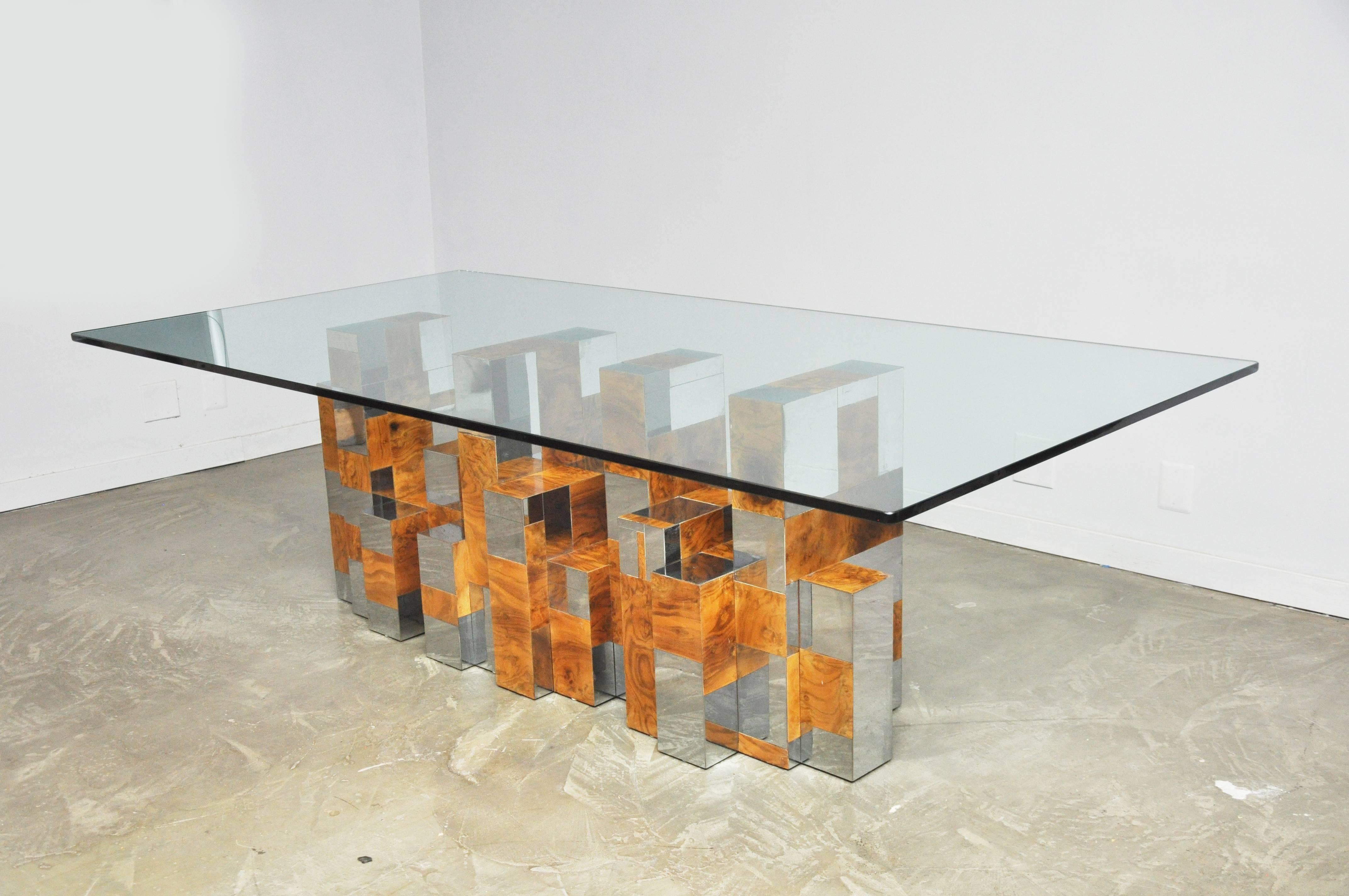 Burl wood and chrome patchwork dining table. Designed by Paul Evans for Directional, circa 1960s. With new glass, this can also be used a console table.

Measures: Glass top 96 x 48.
Base 65 long x 19 deep x 28 tall.

Matching sideboard