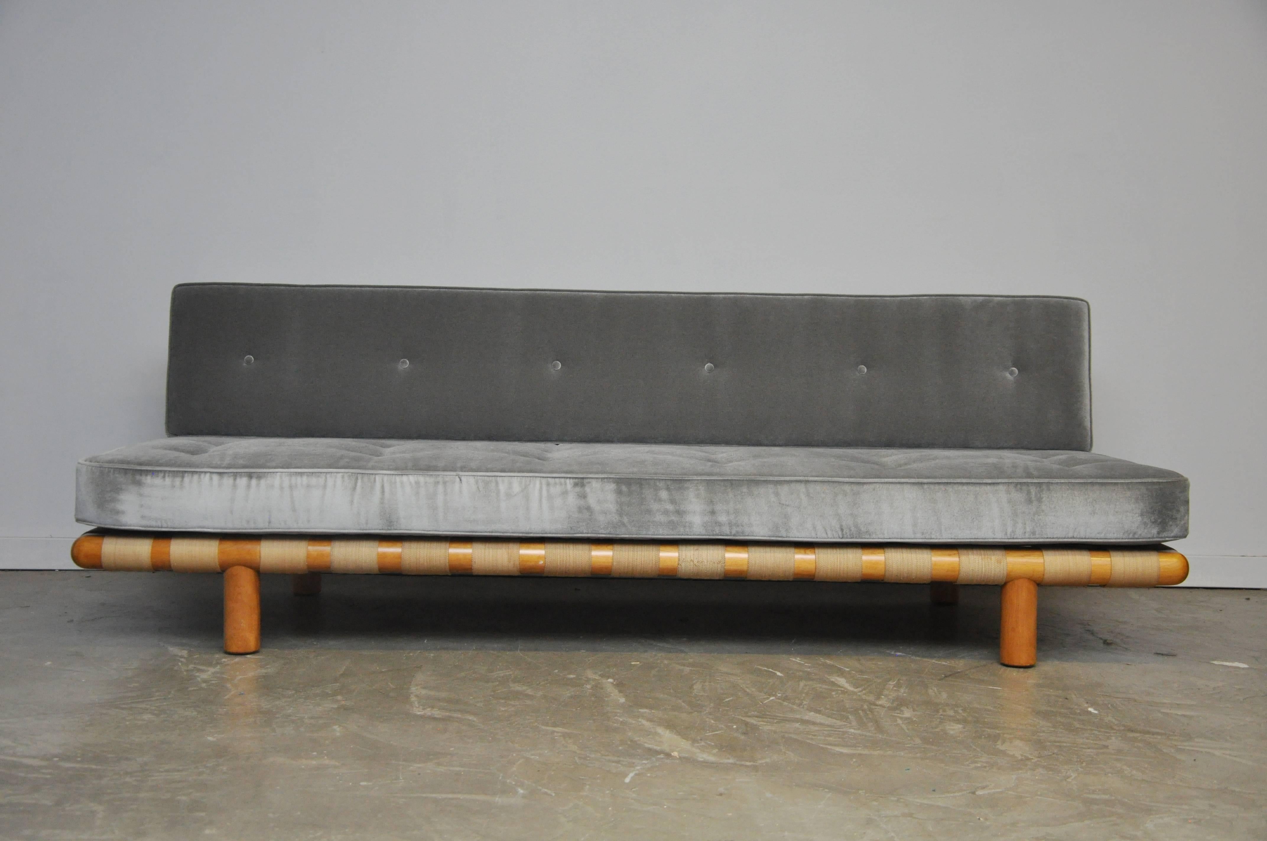 Strapped frame sofa by T.H. Robsjohn-Gibbings. Frame and strapping in very good vintage condition. New foam and ultra plush velvet upholstery.