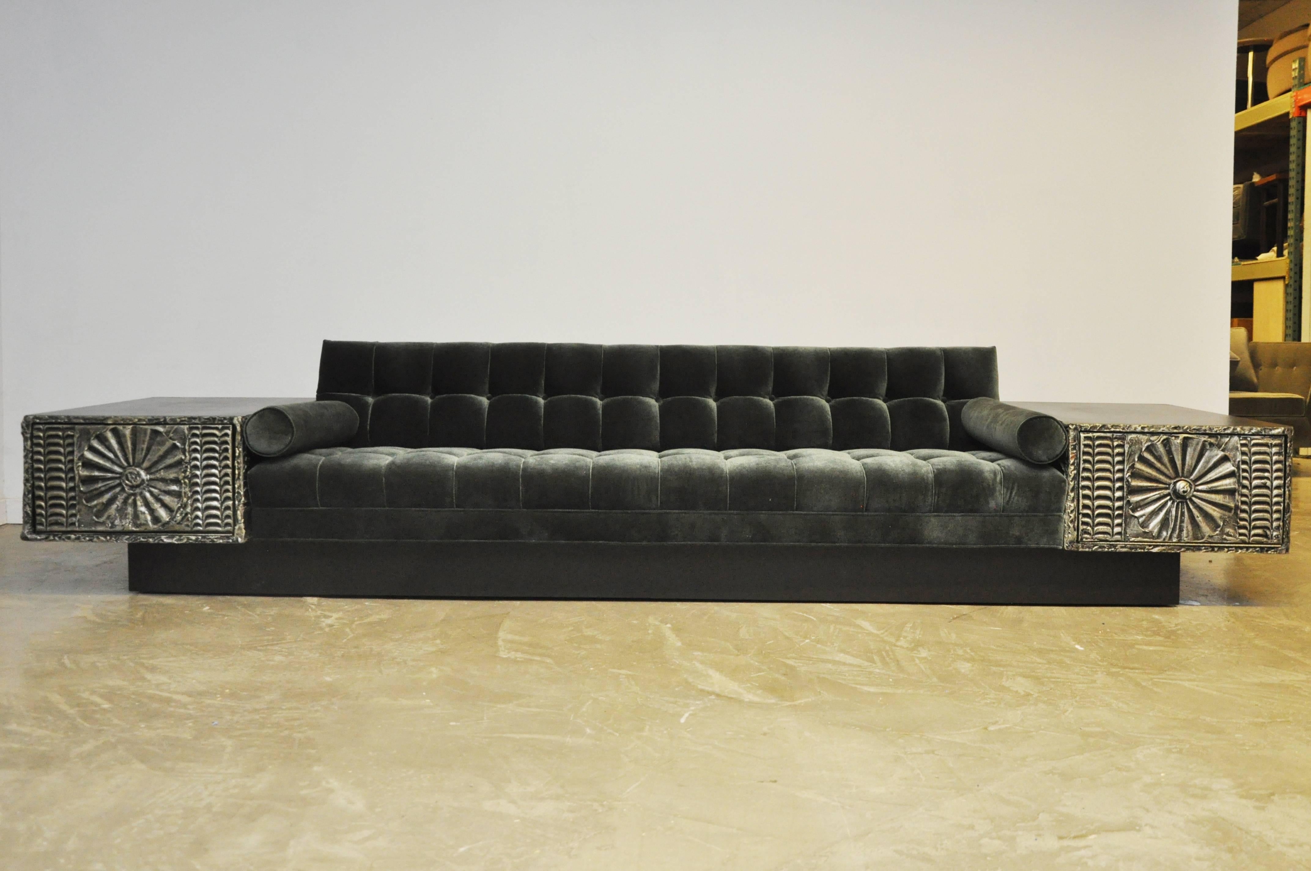 Brutalist platform sofa by Adrian Pearsall. Fully restored. Newly upholstered in biscuit tufted velvet. Built in side tables with drop down fronts for storage.