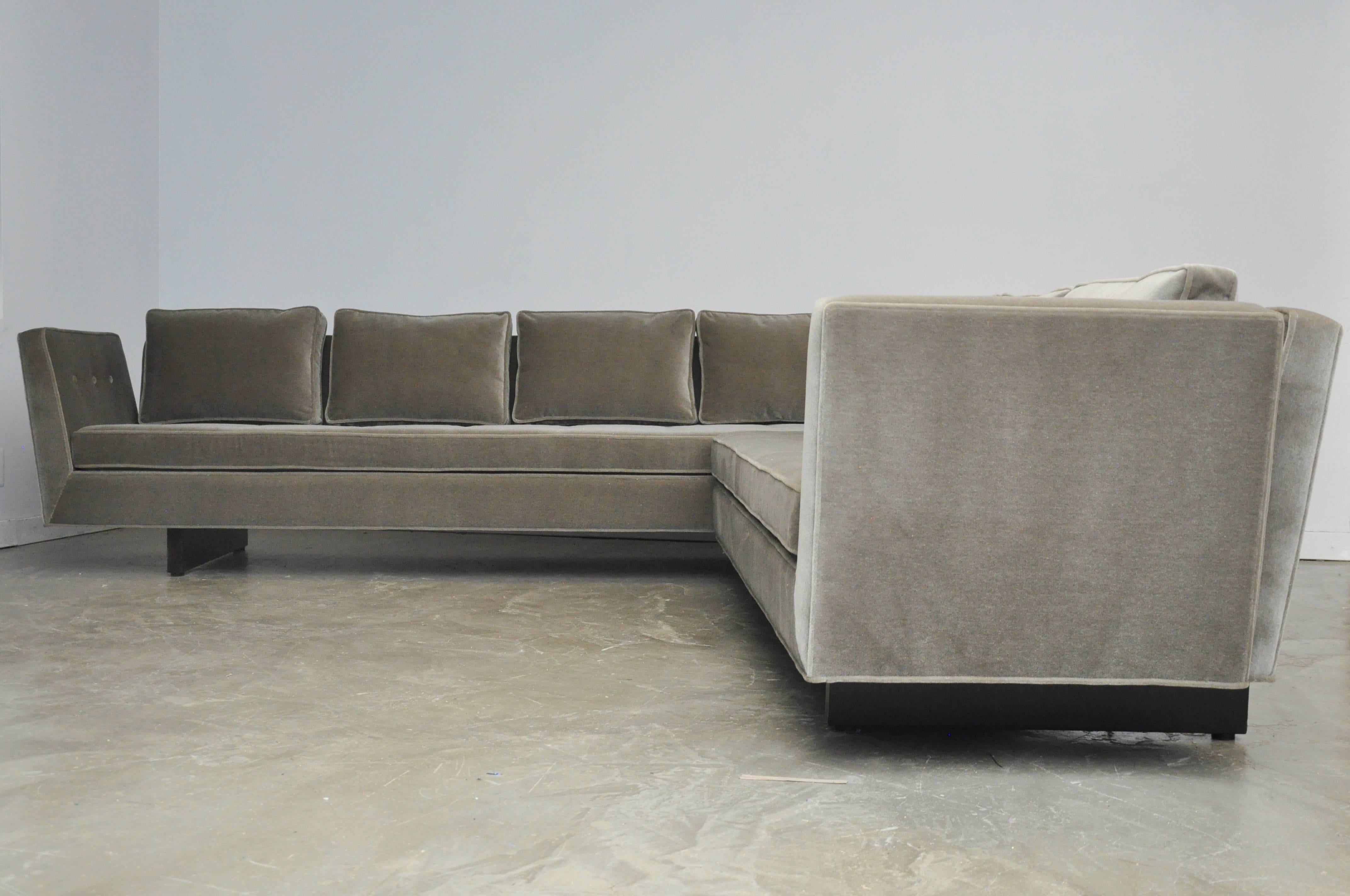 Rare open-arm sectional sofa with exposed bracket back frames. Fully restored and reupholstered. New grey mohair upholstery with Dunbar espresso finish frames.