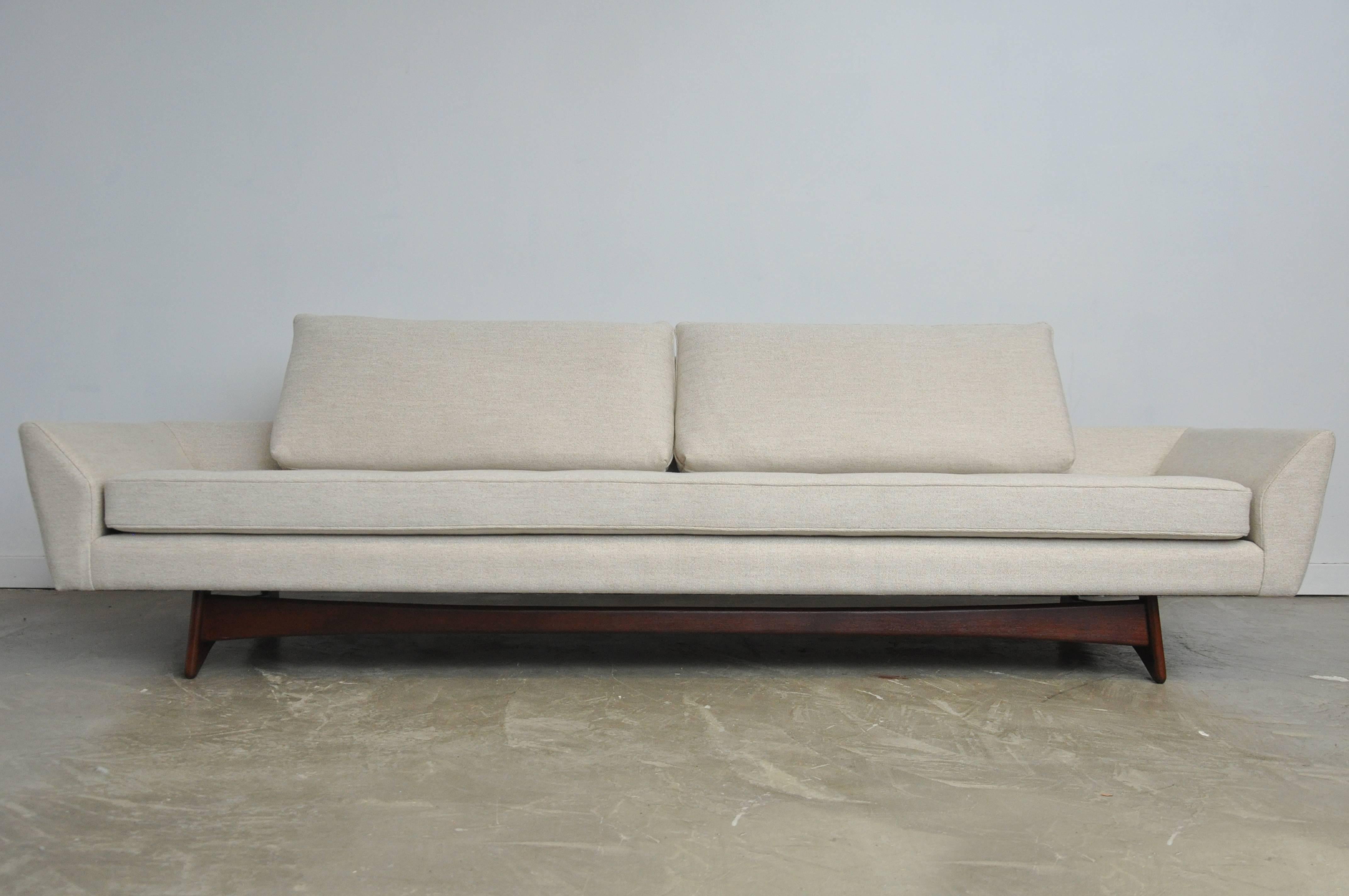 Adrian Pearsall sofa designed sofa on sculptural walnut base. Fully restored and reupholstered in oatmeal weave fabric.
