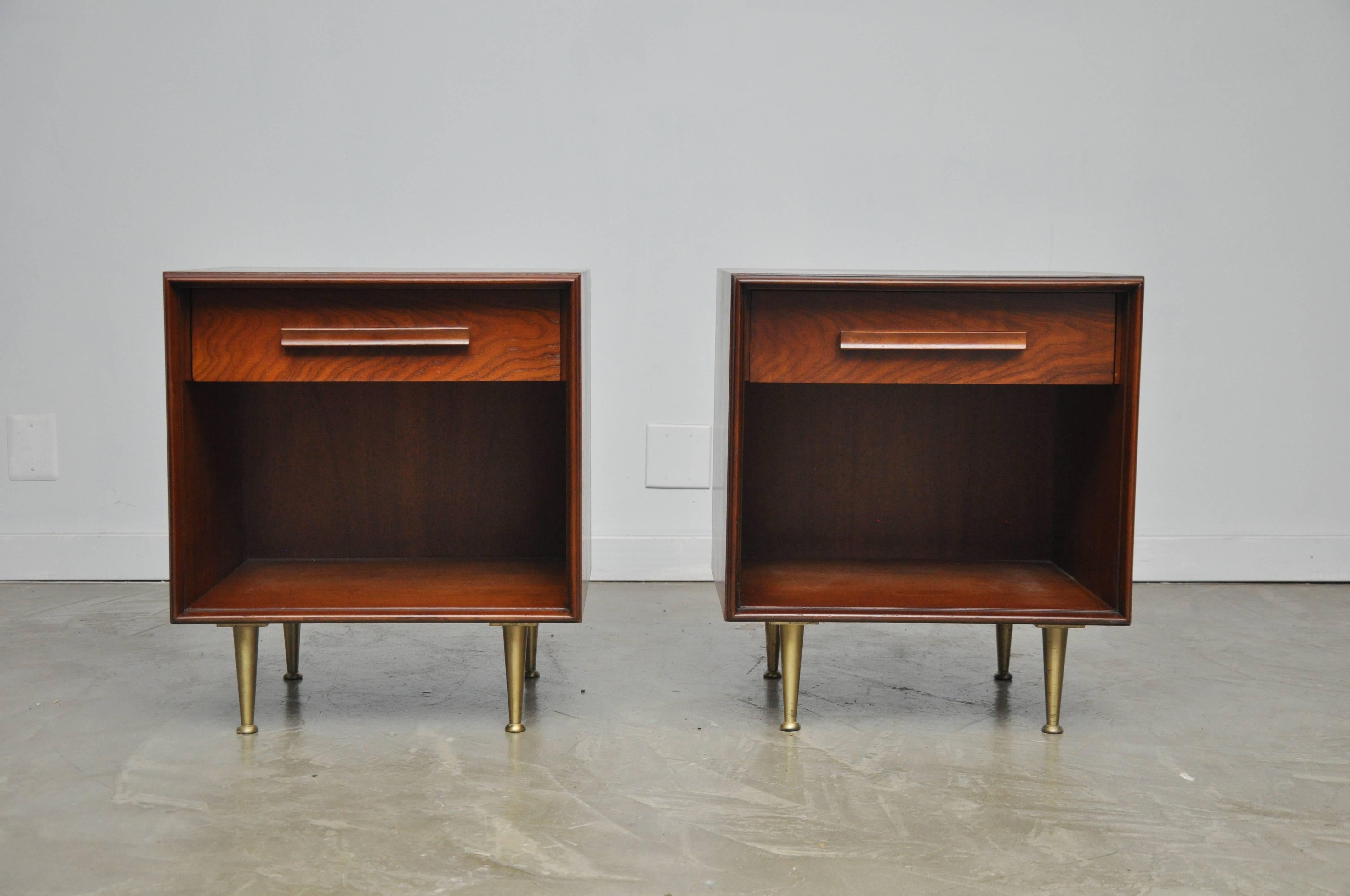 Pair of walnut nightstands with brass legs by T.H. Robsjohn-Gibbings for Widdicomb.

Matching chest is available.
