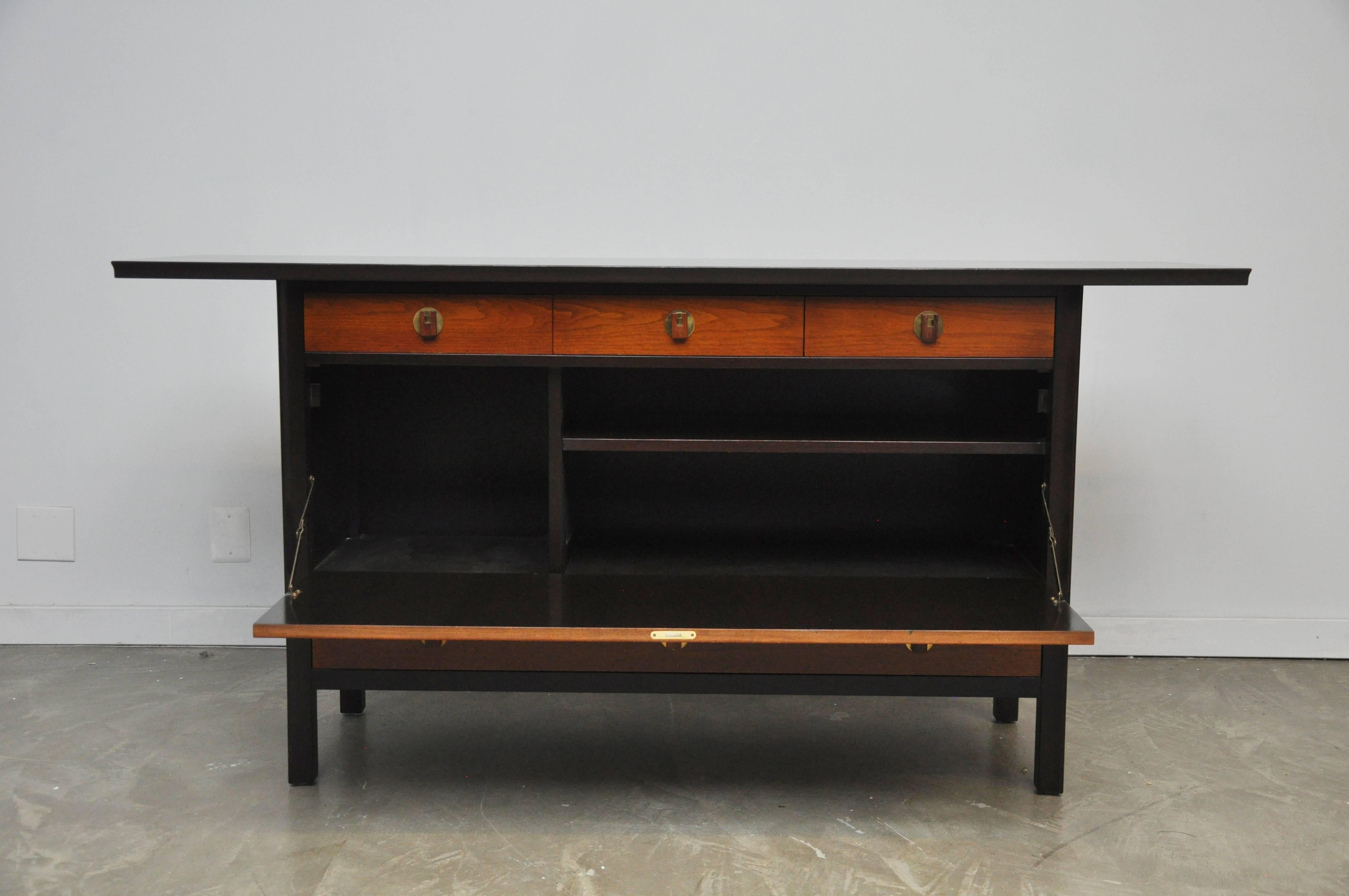 Beautiful sideboard with cantilever sides by Edward Wormley for Dunbar. Mahogany case, walnut drawers, rosewood & brass pulls. 