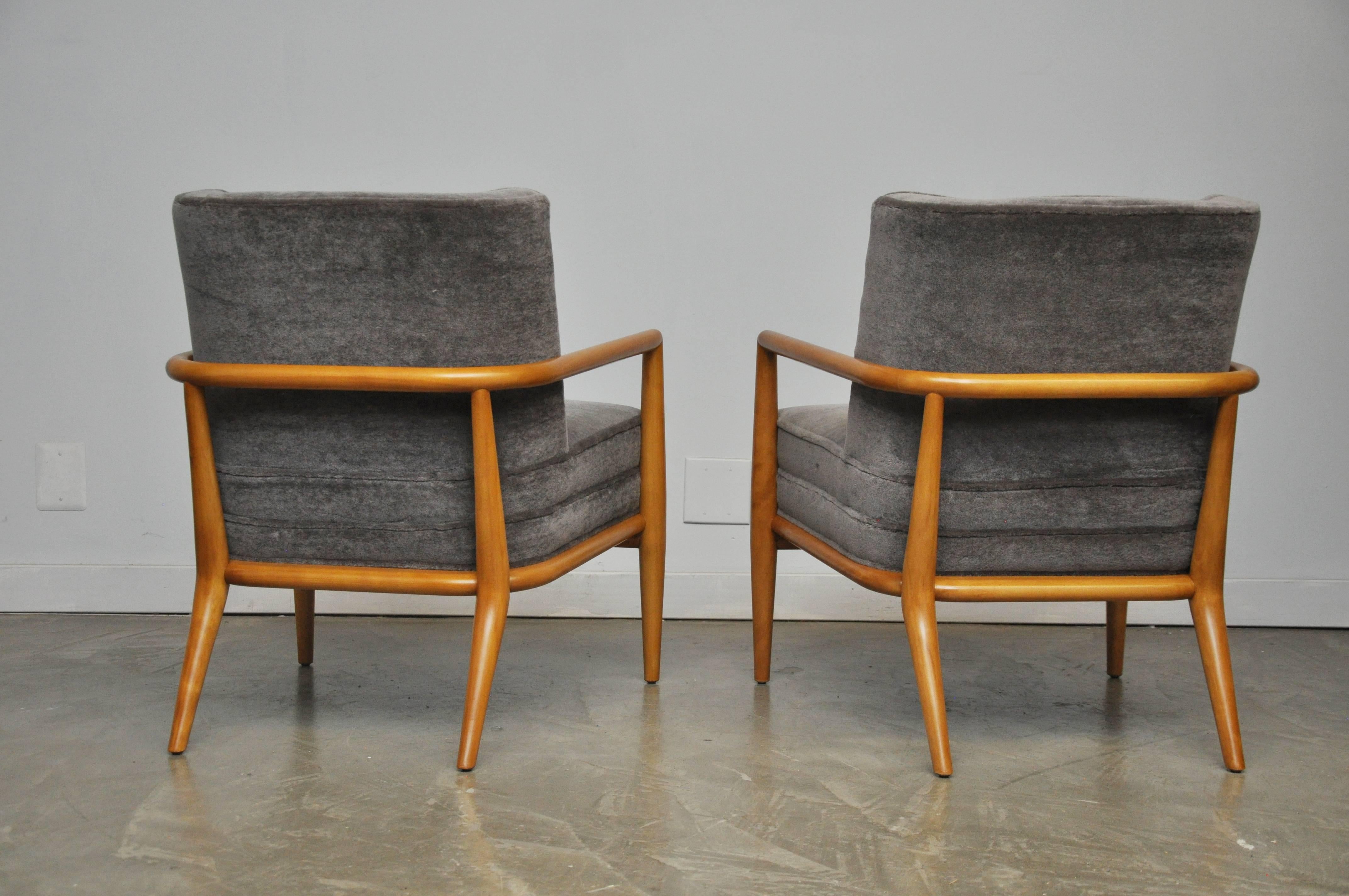 T.H. Robsjohn-Gibbings designed lounge chairs for Widdicomb. Restored original wood finish in excellent condition. Newly upholstered in ultra plush mohair.