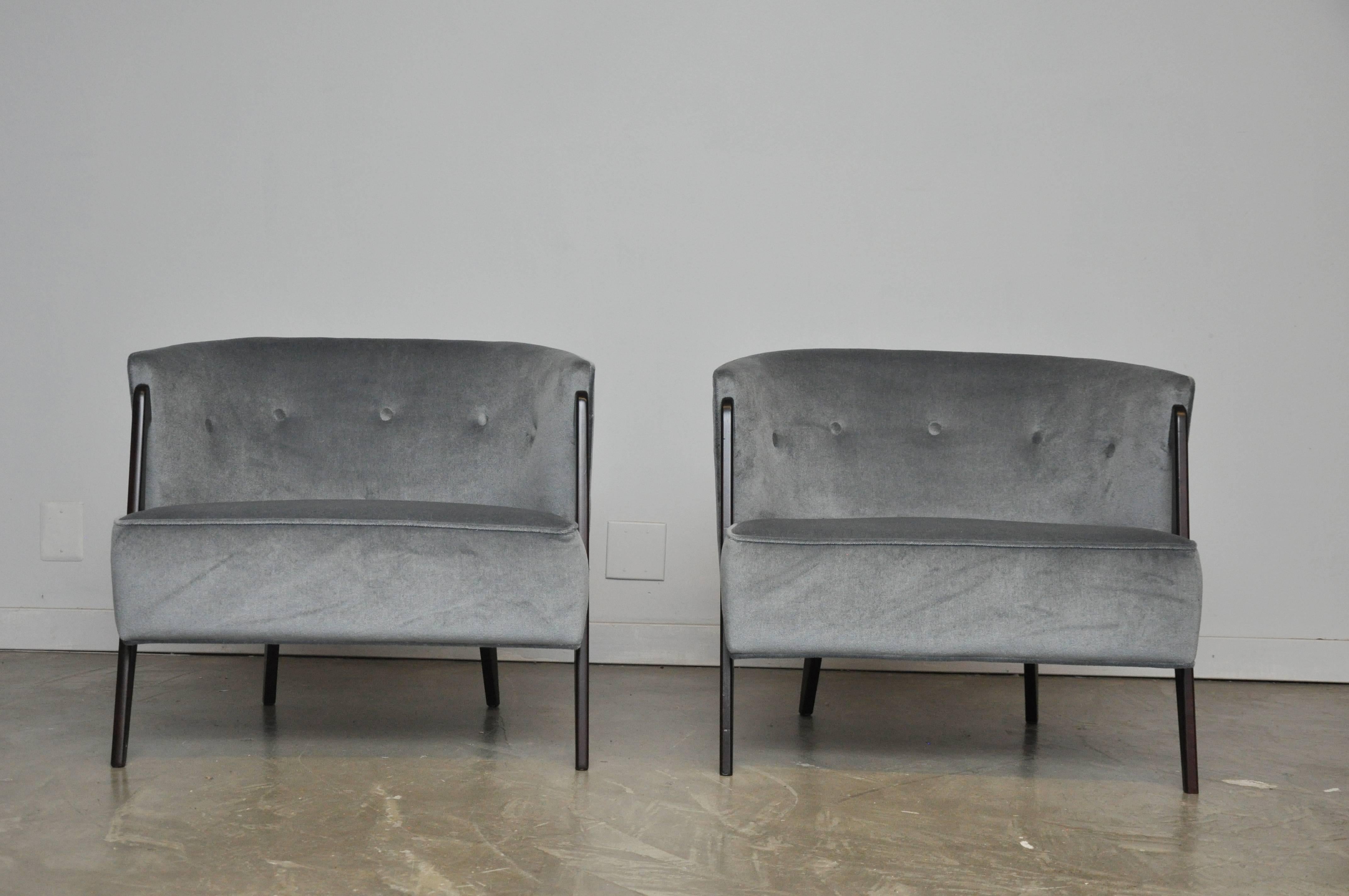 Pair of splayed leg lounge chairs by Karpen of CA. Fully restored exposed frames, done in espresso finish. Reupholstered in grey mohair.