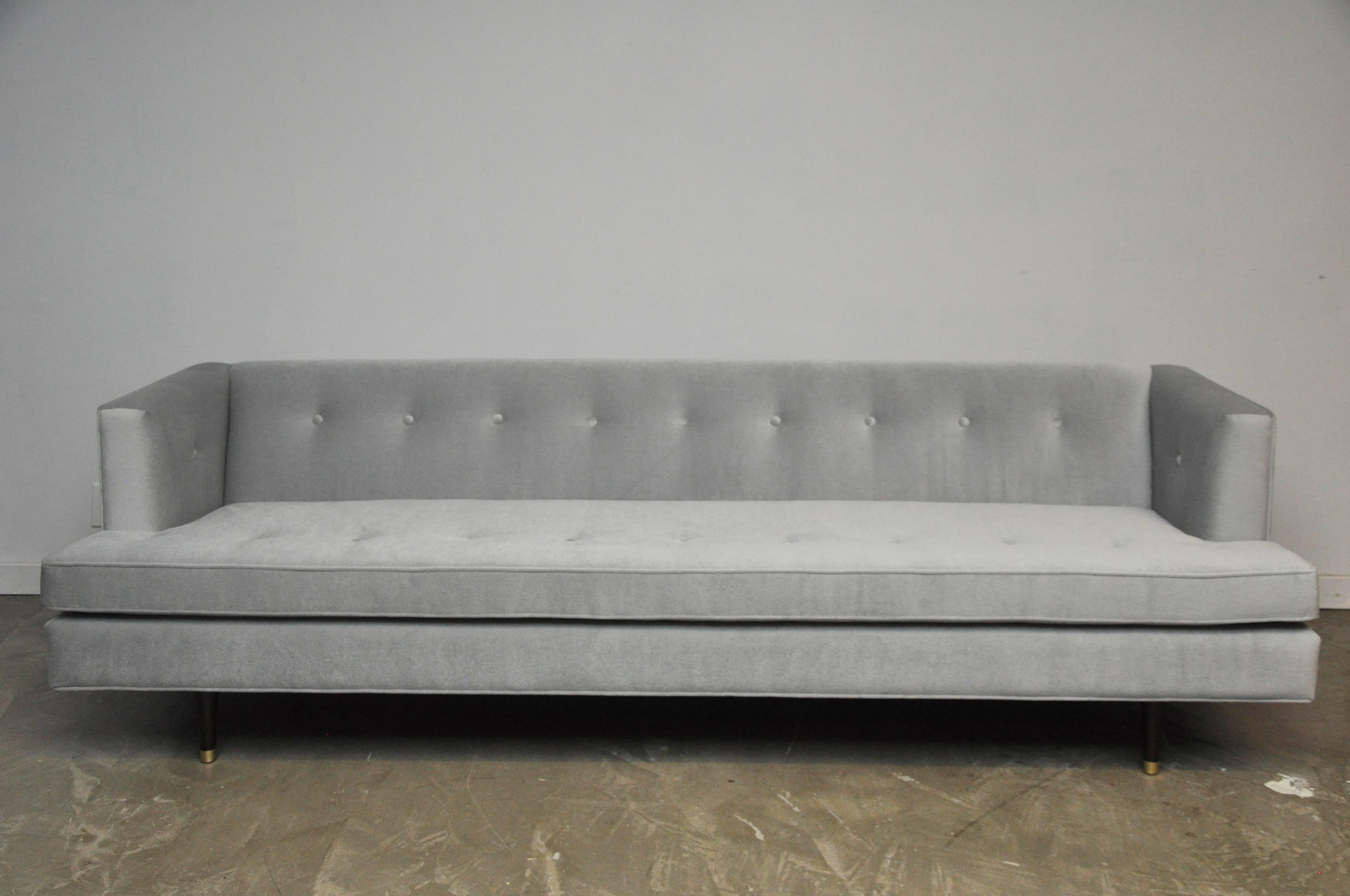 Classic Dunbar sofa by Edward Wormley. Fully restored and reupholstered in light grey mohair.  

We do have another of this sofa, if a pair is needed.