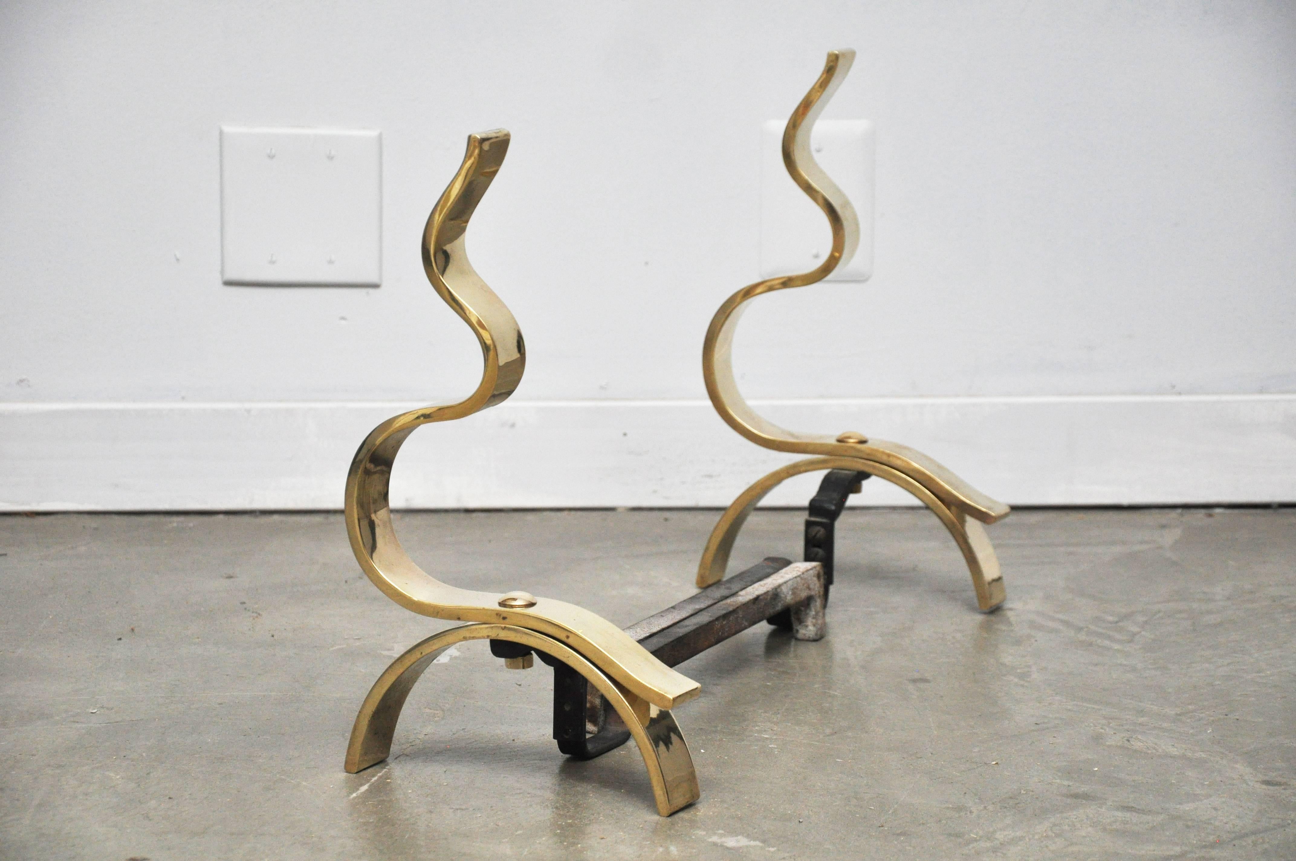 Pair of 1960s brass andirons. Abstract flame form. Fully restored.