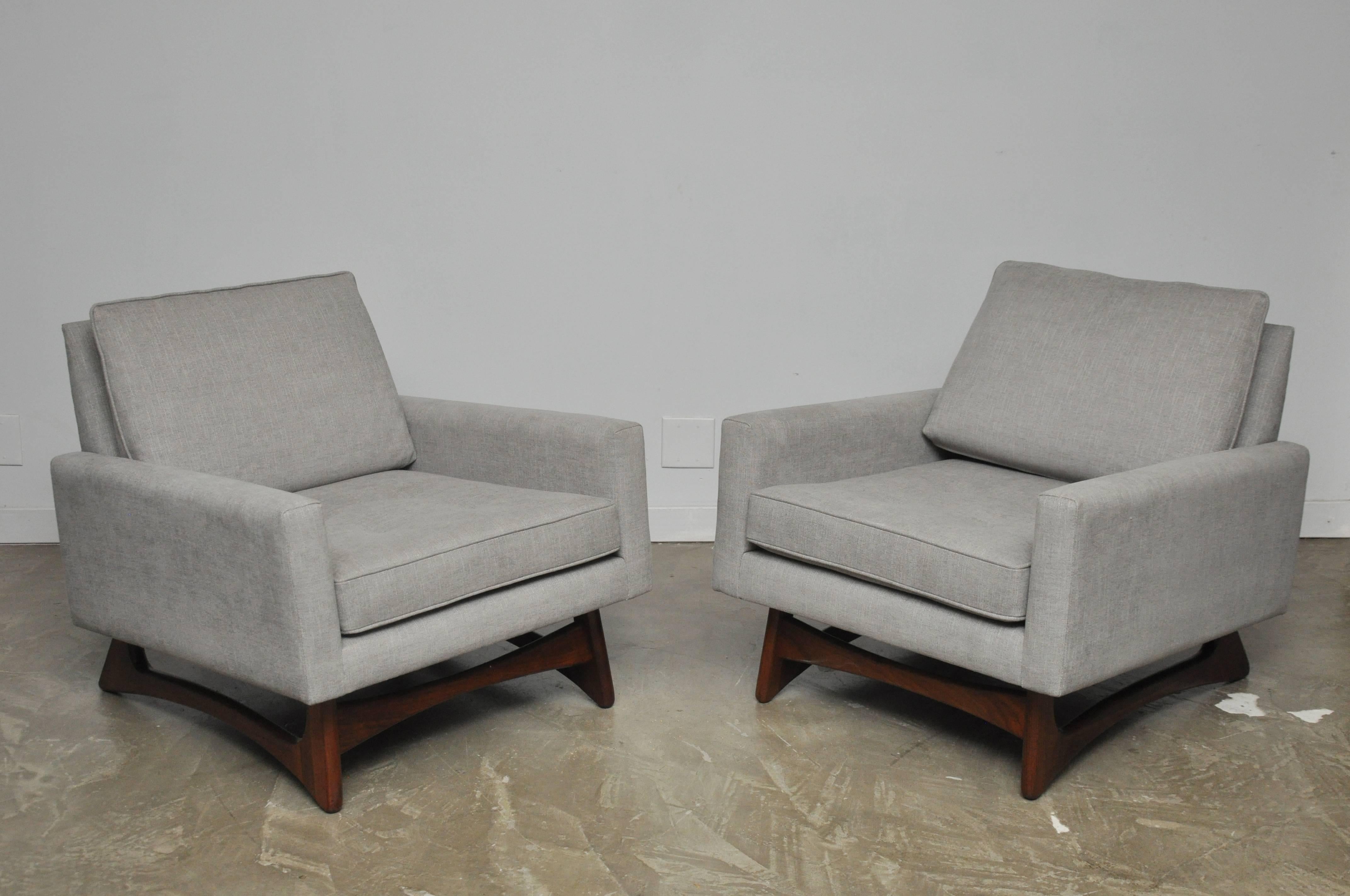 This fully restored pair of Gondola club chairs by Adrian Pearsall. Refinished sculptural walnut bases with new upholstery.