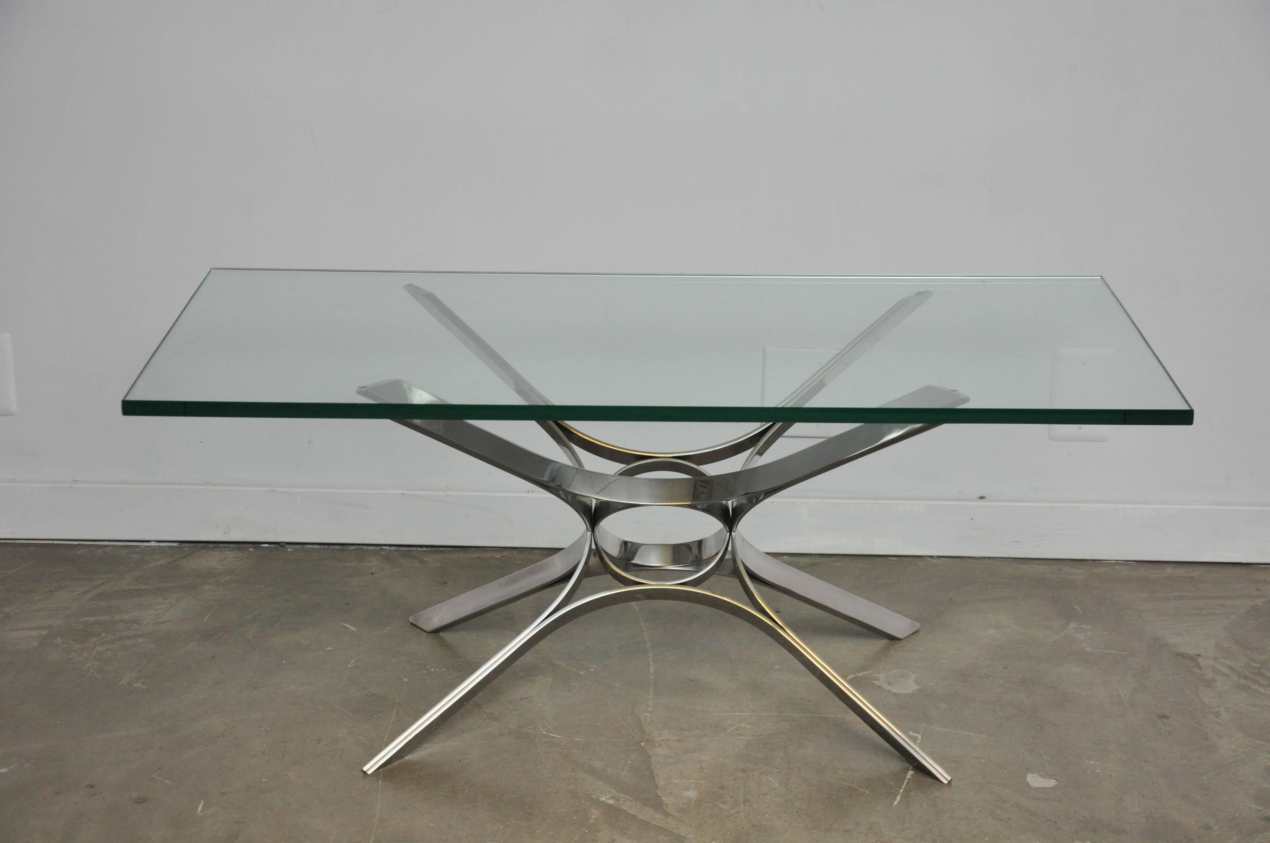 Sculptural form chrome base coffee table with glass top. Designed by Roger Sprunger for Dunbar, circa 1970s.