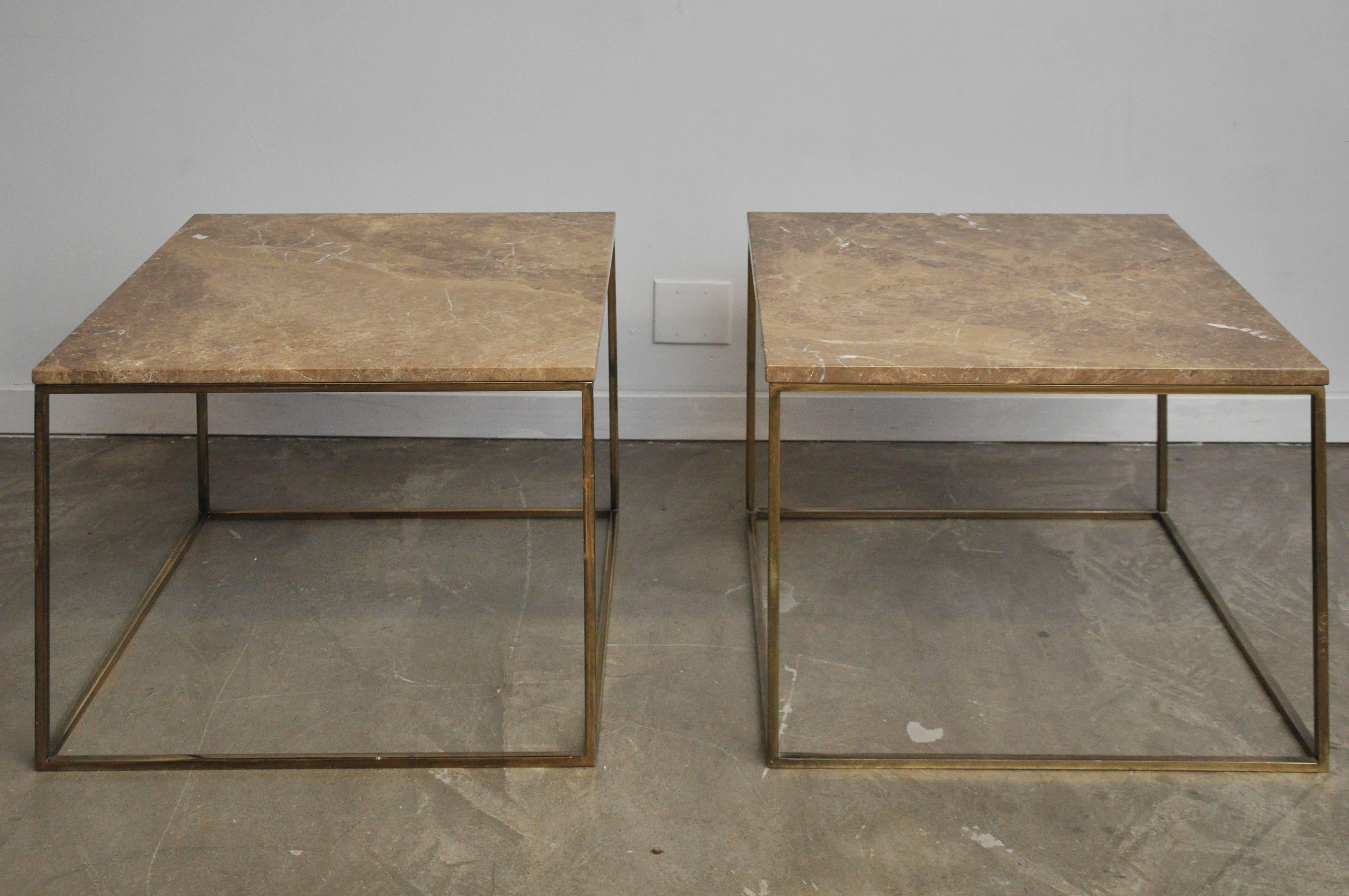 Pair of large-scale brass frame side tables with travertine stone tops.
