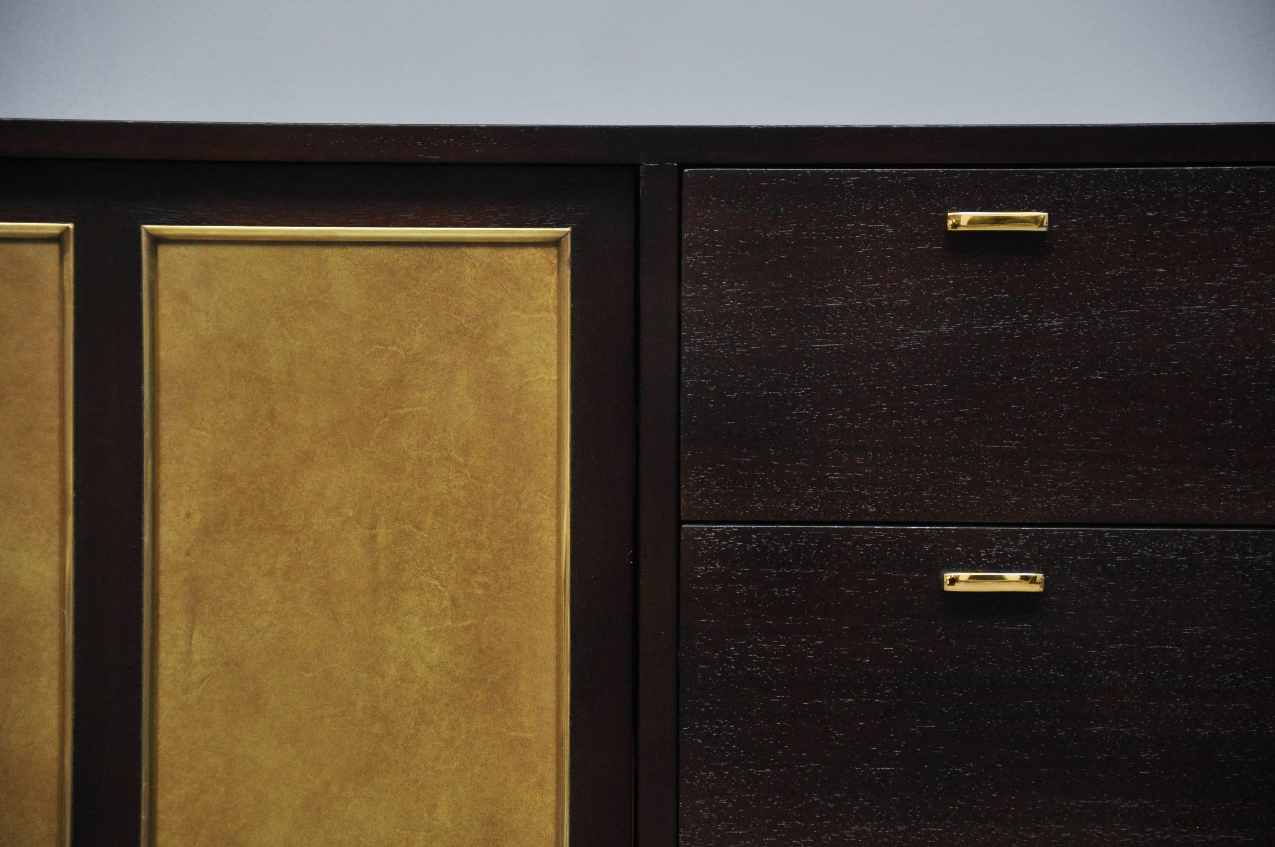 Long credenza by Harvey Probber. Fully restored. Refinished in espresso tone with original goldenrod aluminum doors.