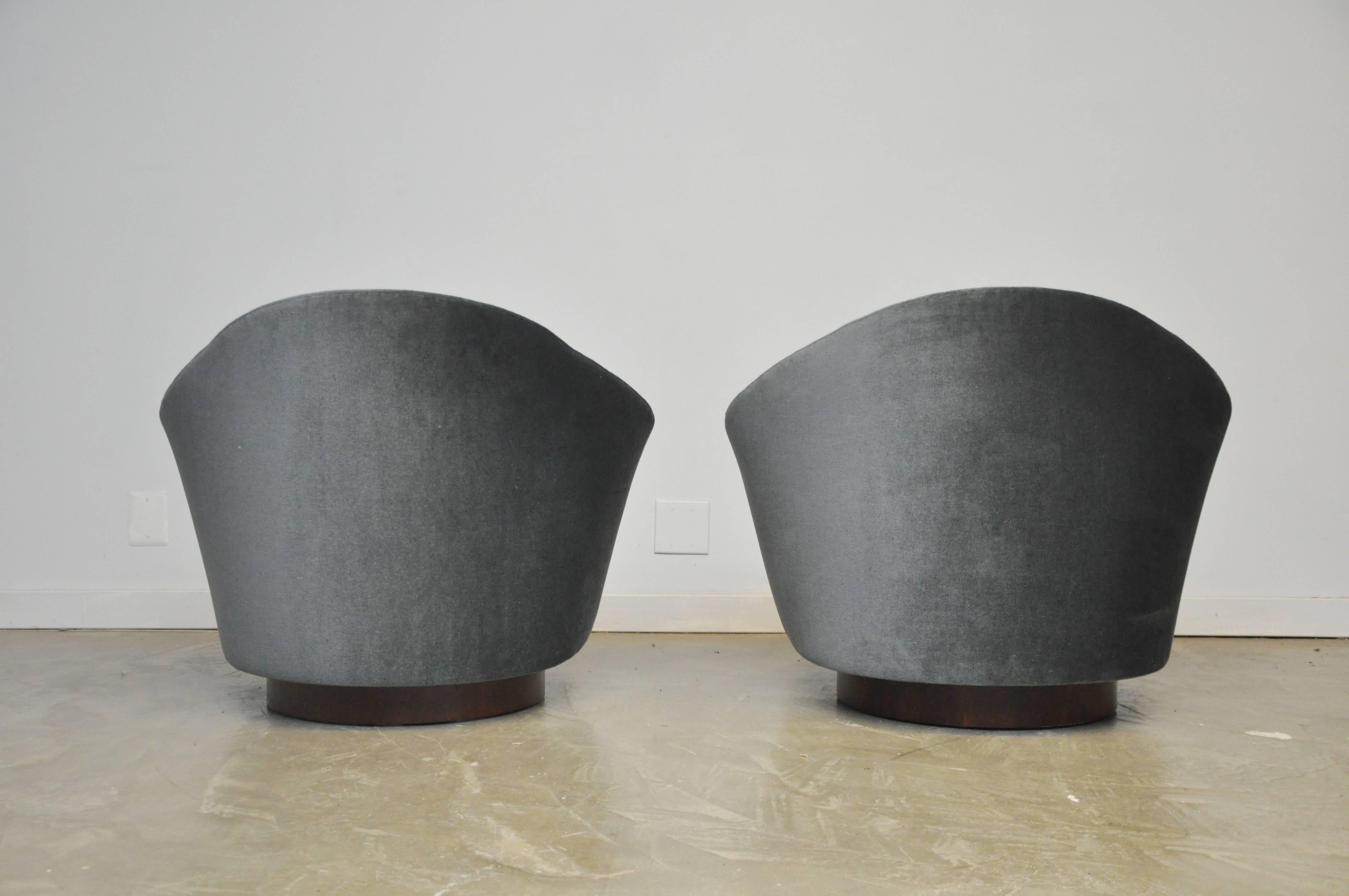 Pair of tilt and swivel chairs by Adrian Pearsall. Fully restored. Walnut bases with new charcoal mohair upholstery.
