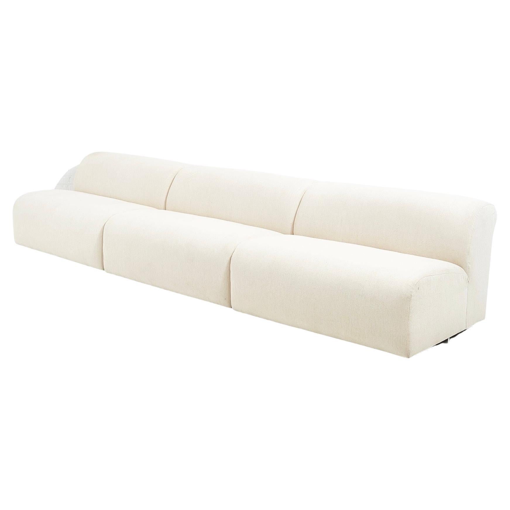3 Piece Modular sectional sofa by Vladimir Kagan for Preview, 1988. Original white fabric is in good condition. There is a spot on one cushion.

