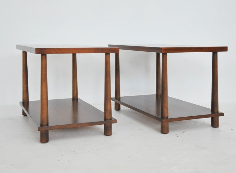 Pair of end tables by T.H. Robsjohn-Gibbings. Fully restored and refinished in walnut tone.