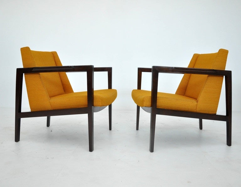 Open frame lounge chairs by Edward Wormley for Dunbar. Dark espresso finish mahogany frames with original orange upholstery.