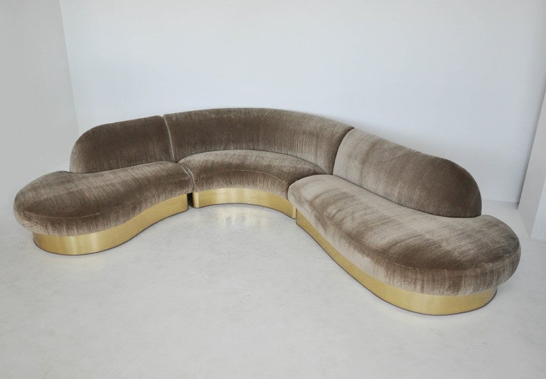 Large serpentine sofa by Milo Baughman. Three-piece curved sectional. Newly upholstered in plush mohair.