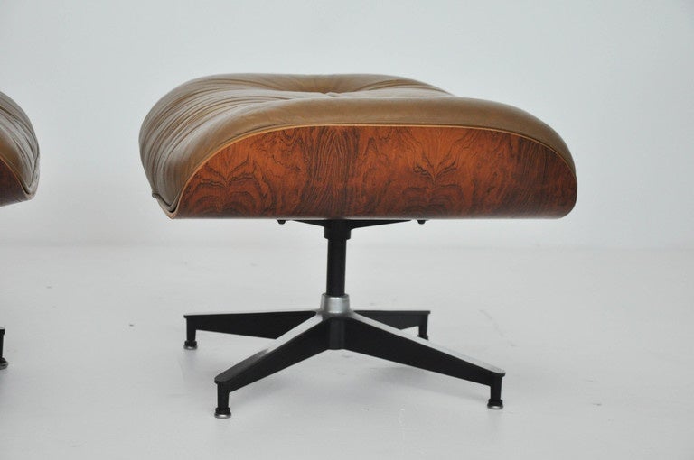 Rosewood lounge chair and ottoman designed by Charles and Ray Eames for Herman Miller, circa early 1970s. Original tan leather. Excellent all original condition.