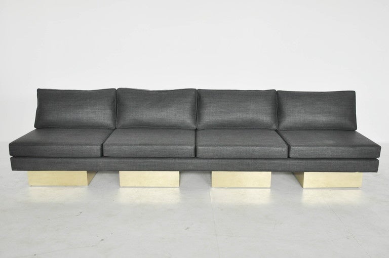 10' sofa with brass bases by Milo Baughman.  Newly upholstered.