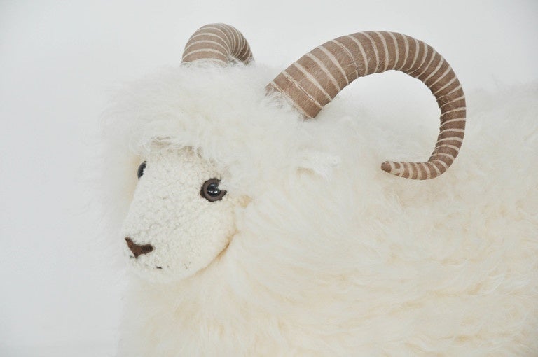 Decorative lifesize sheep with long hair fur coat with leather horns.