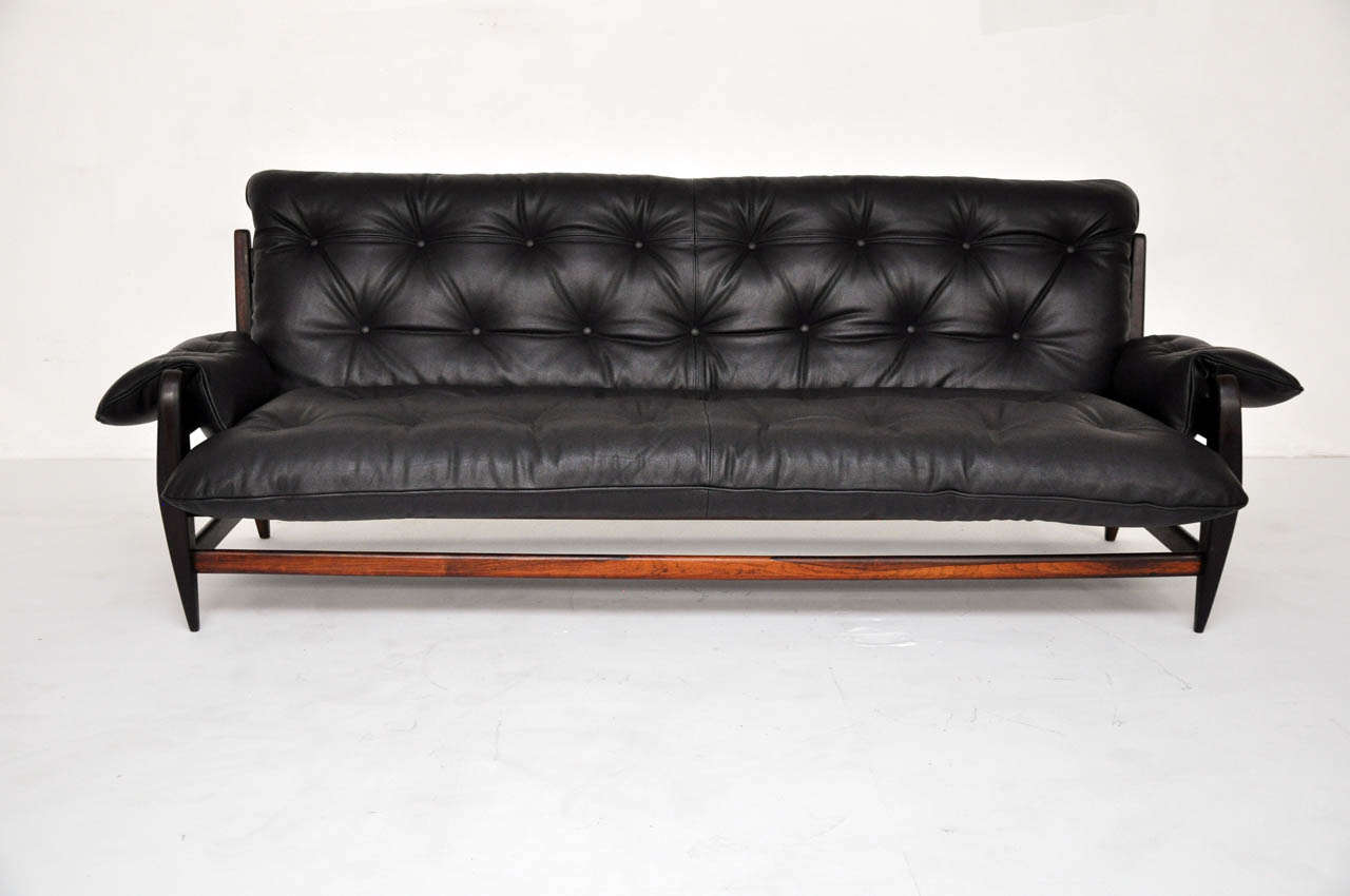 Jacaranda rosewood sofa by Jean Gillon. Made in Brazil, circa 1960s. Fully restored and refinished frame. Newly upholstered in heavy bull hide leather.