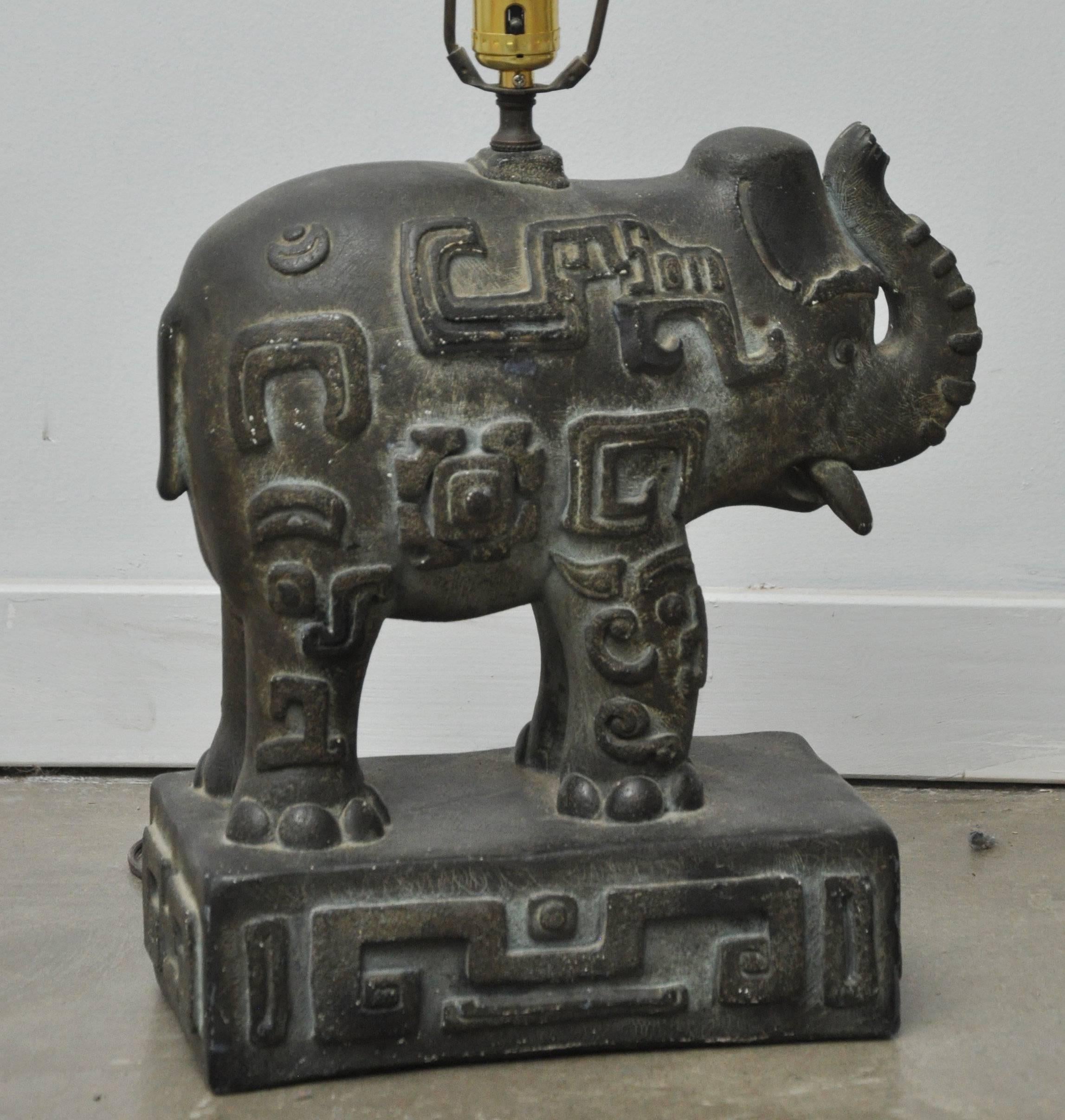 Chic bronzed plaster elephant lamp with decorative details.