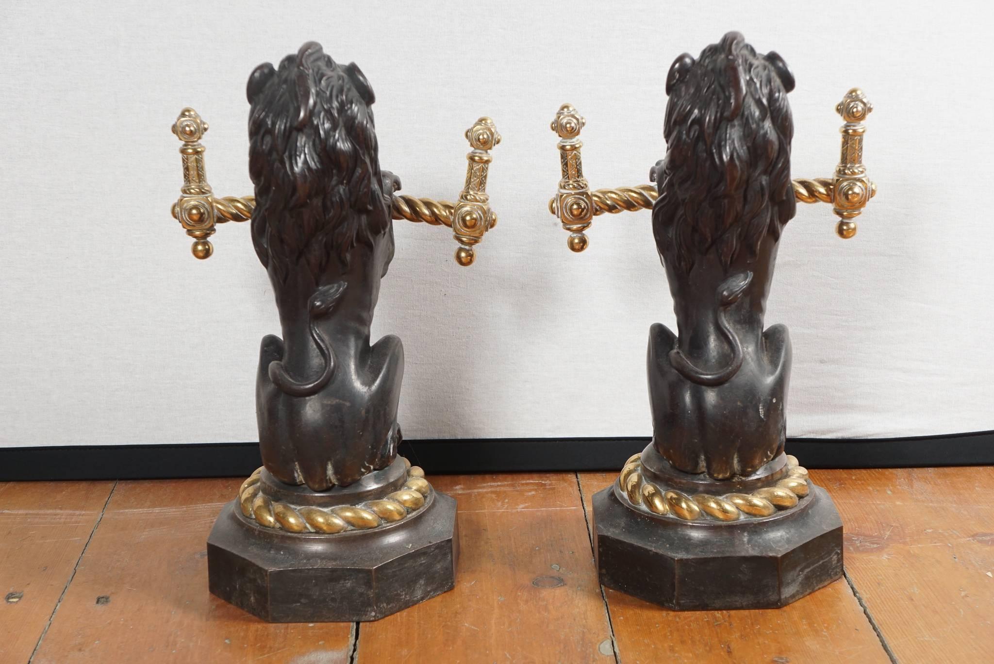 Great pair of English mid-19th century bronze and brass fire tool holders in the form of lions.
