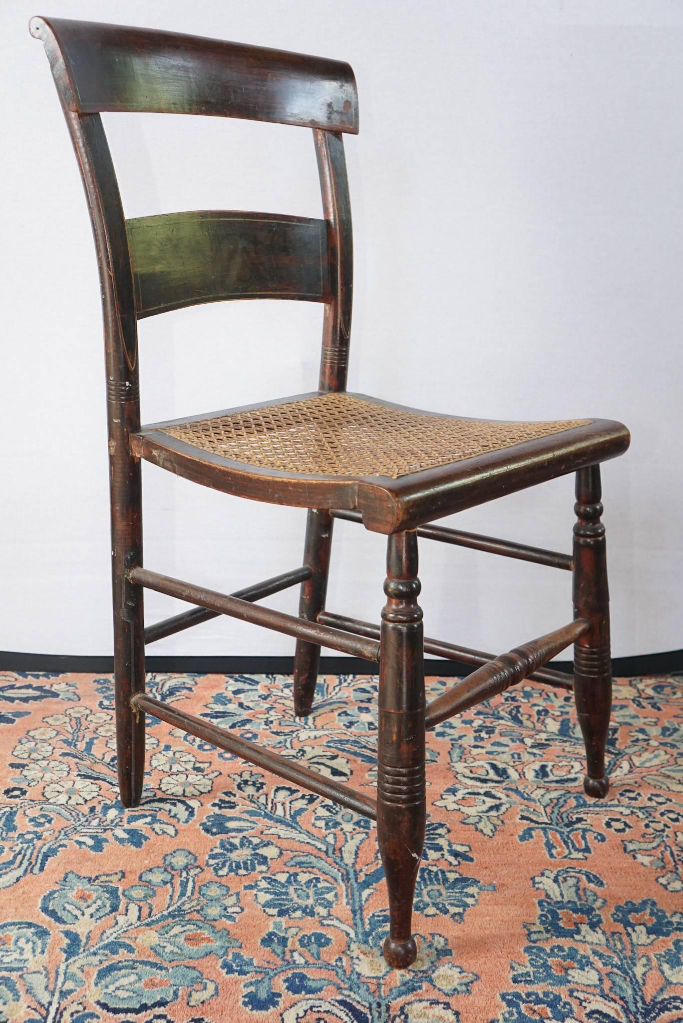 Nice set of American ebonized and decorated side chairs. Original decoration. Caned seats, circa 1825.