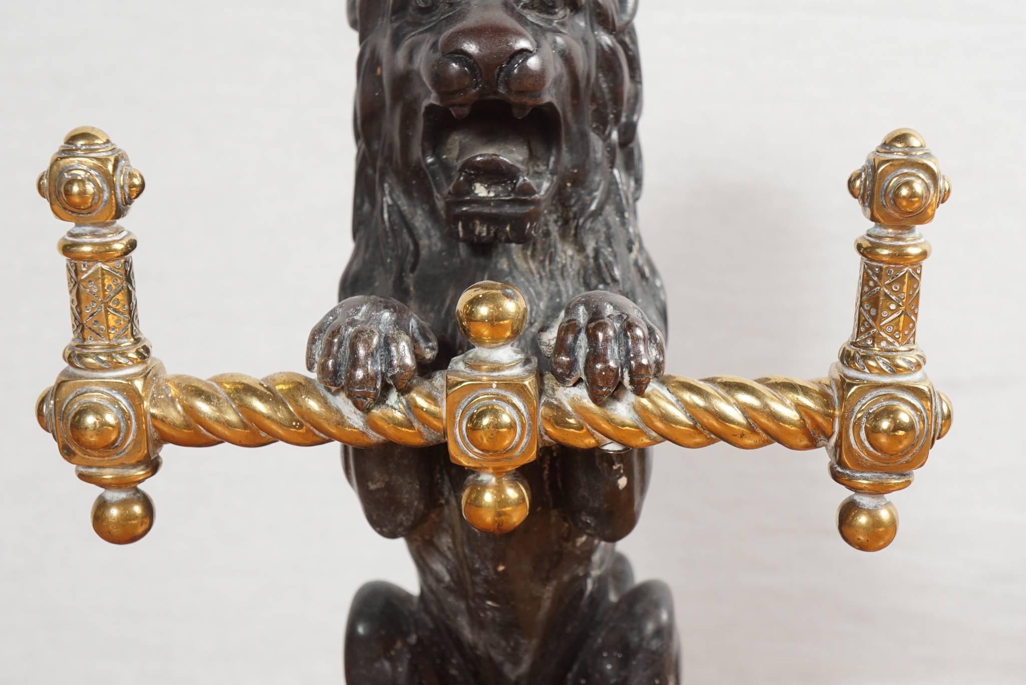 Cast Pair of English 19th Century Lion Form Bronze and Brass Fire Tool Holders