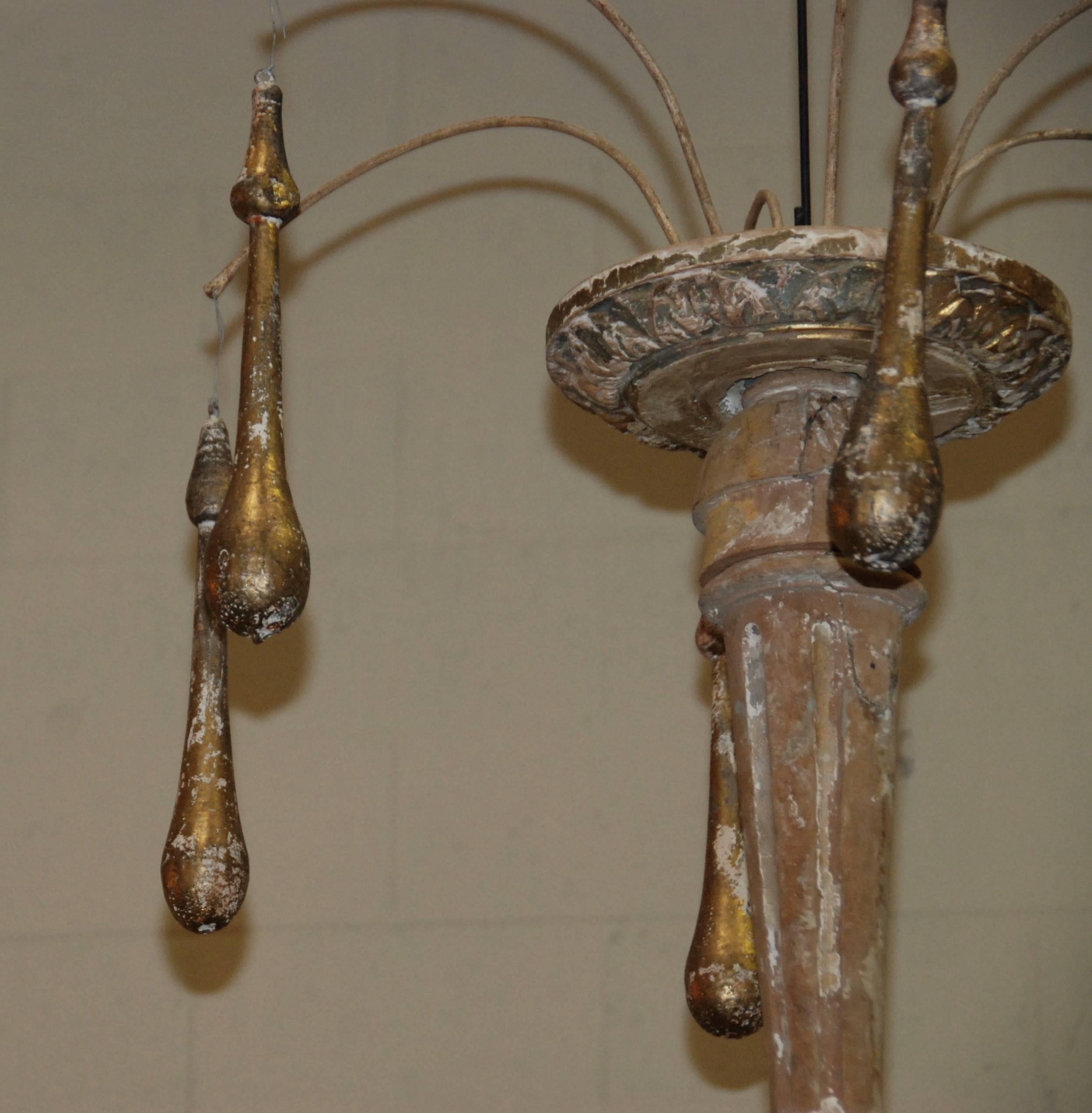 Beautiful large Italian candlestick iron and wood chandelier. Great aged white and gold patina.
