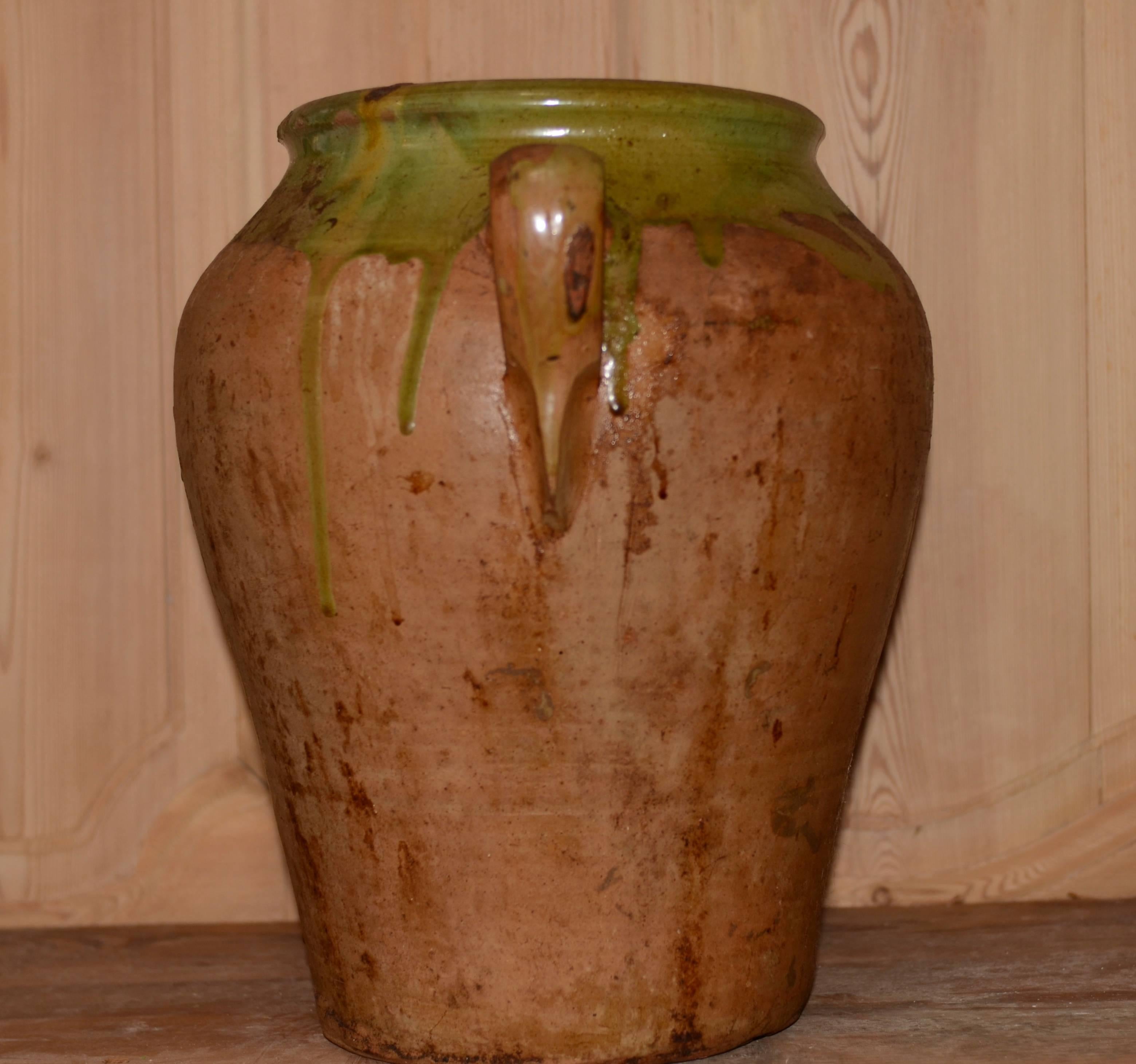19th century French green glazed grand confit pot from Provence. Lovely aged glazed patina.