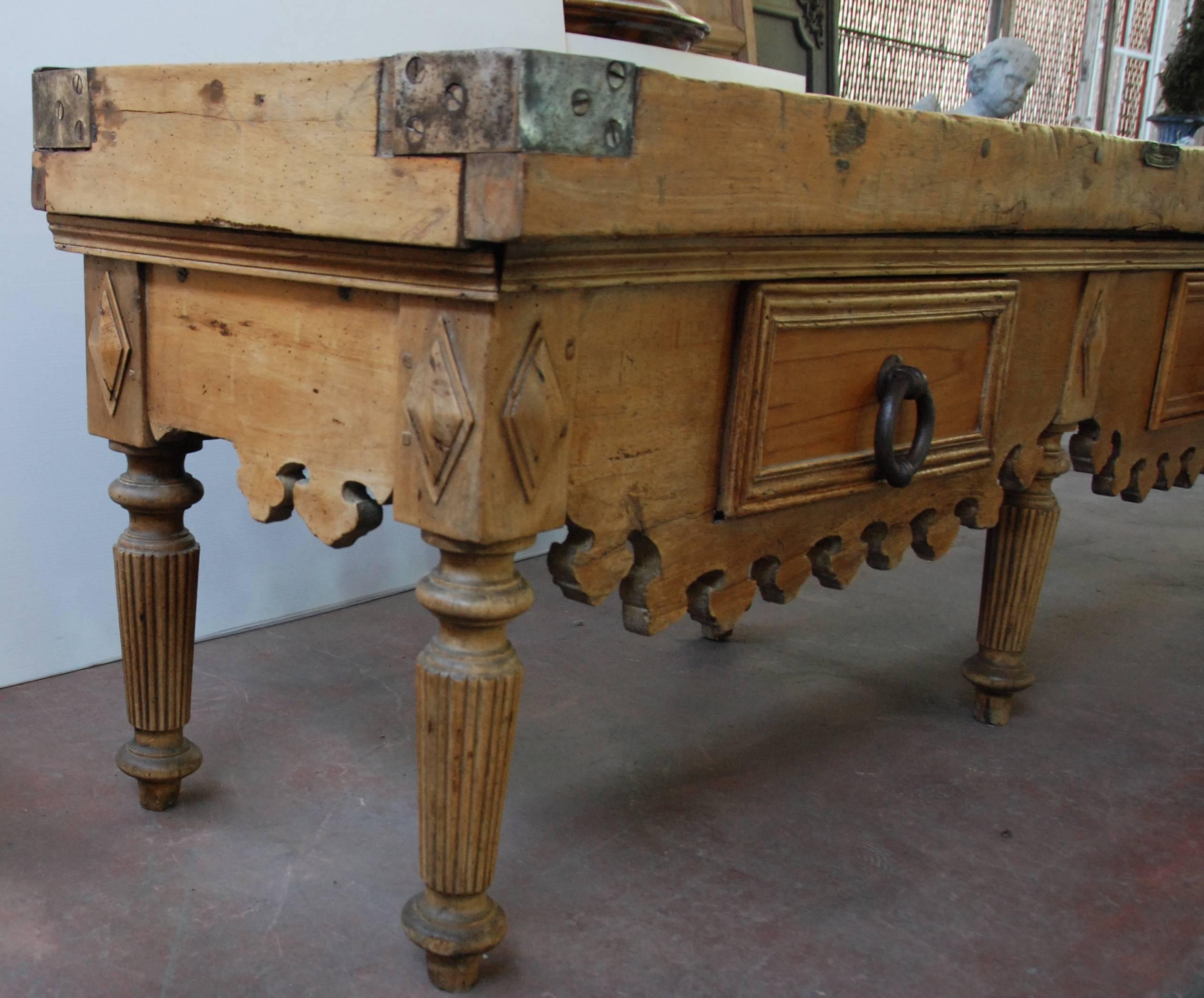 Beautiful 19th century Vergne & Cie butcher block from Paris, France. Carved scalloped apron over two large drawers and six fluted legs. Beautiful white marble top, made later, included. 