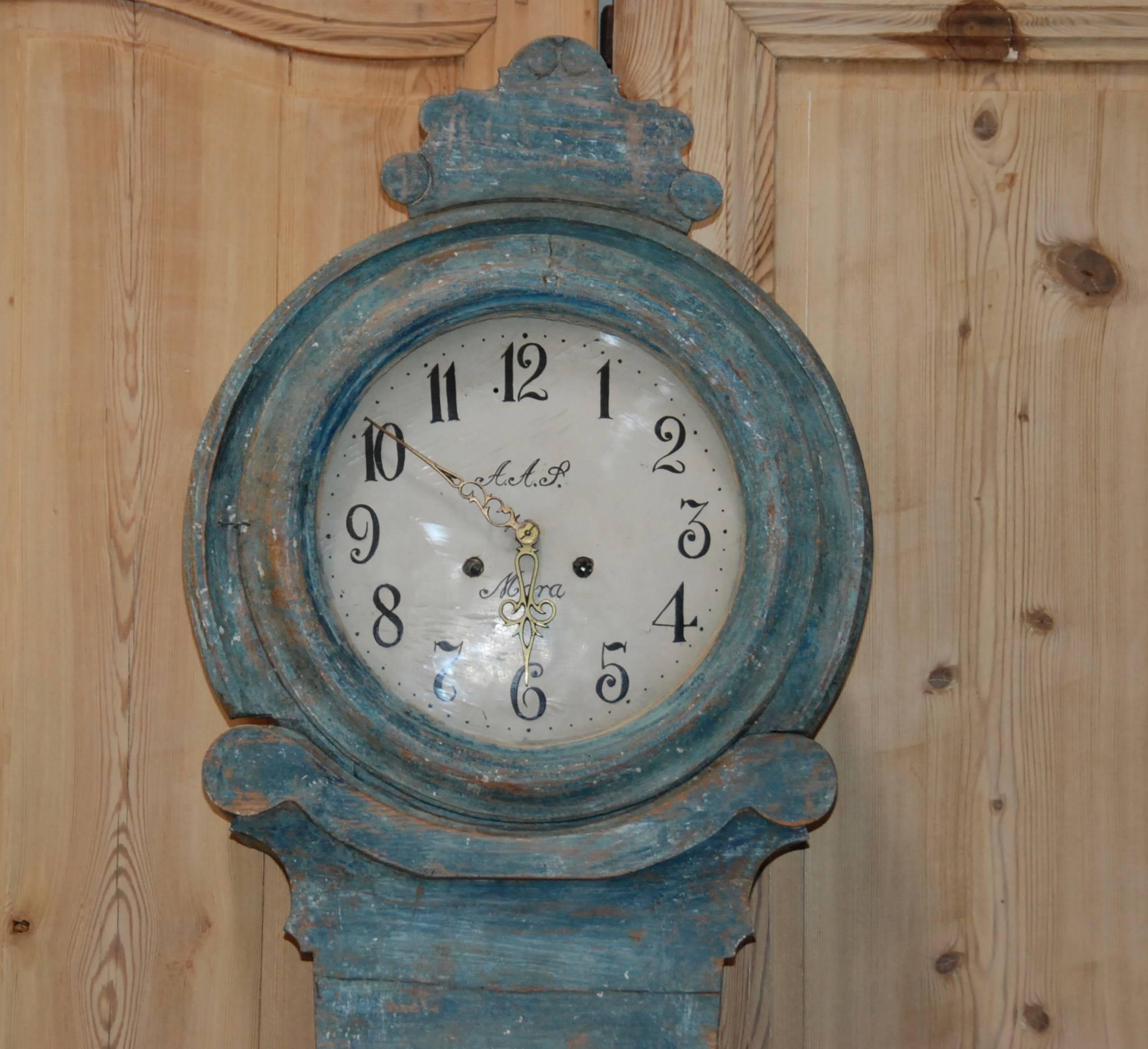 19th century Swedish Mora clock with lovely scalloped base and carved top. Beautiful Swedish blue color. Clock comes with original weights and pendulum. Very handsome piece!